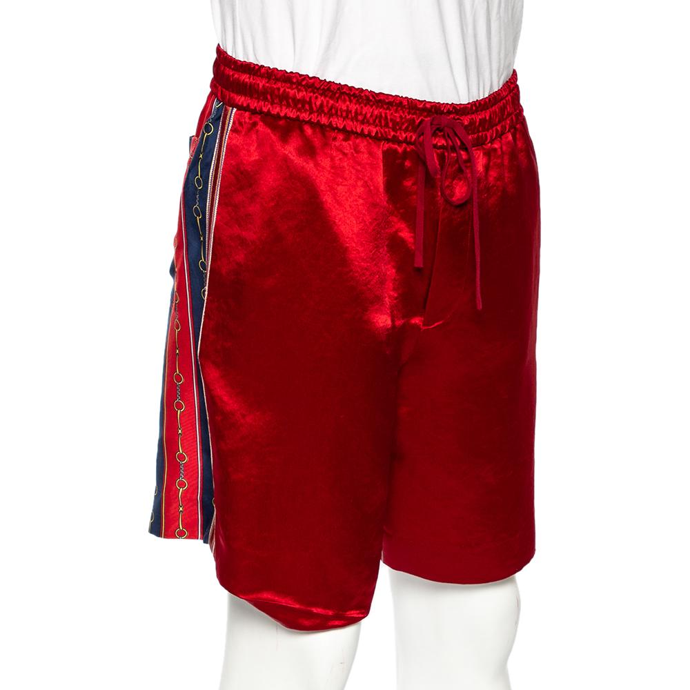 Now lounge around in comfort with these shorts from Gucci. The striking red-hued shorts are tailored from luxurious silk-blend and feature a drawstring tie and a signature pattern at the back.

