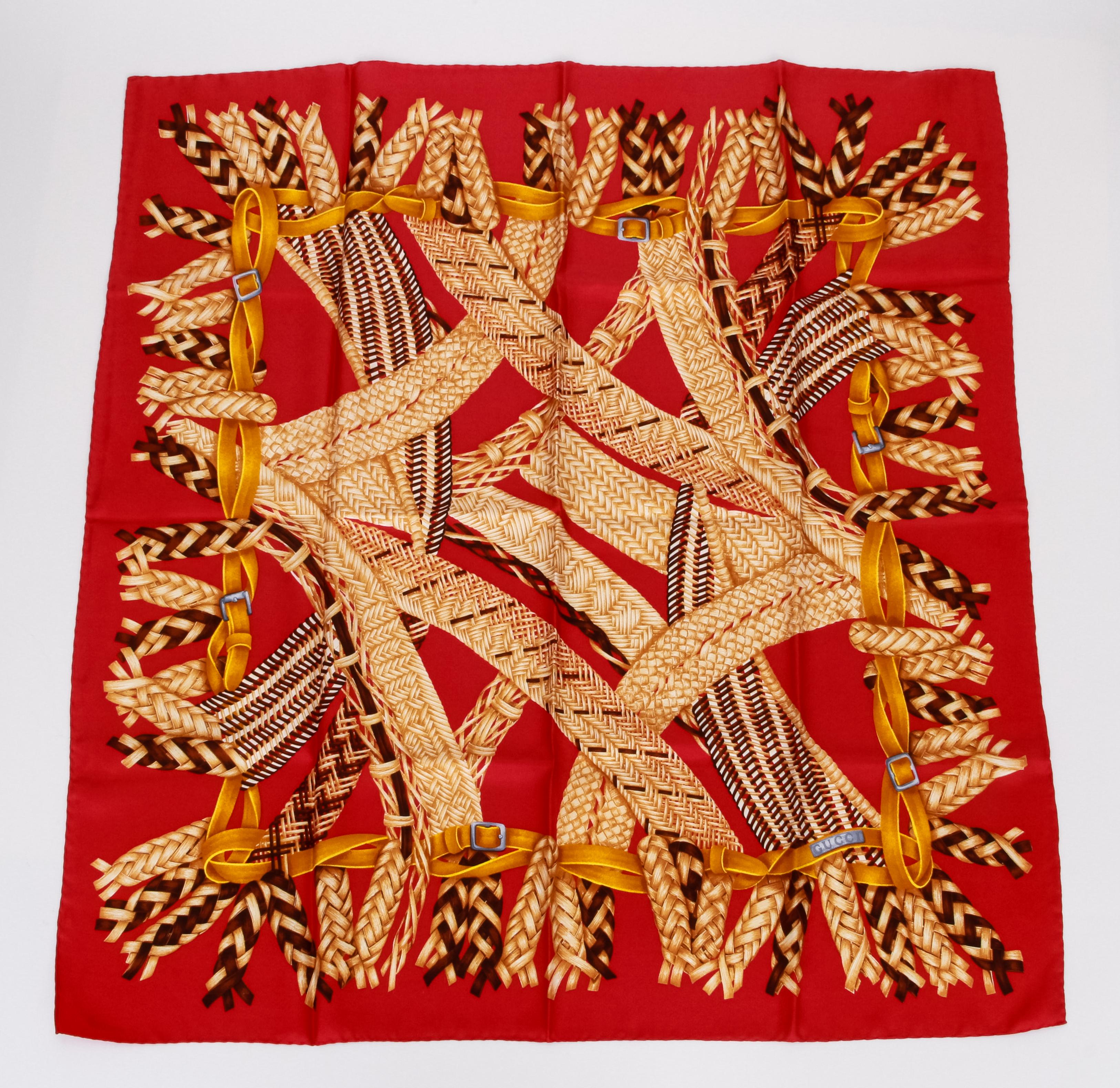 Gucci red silk scarf with straw design. Hand rolled edges.
35
