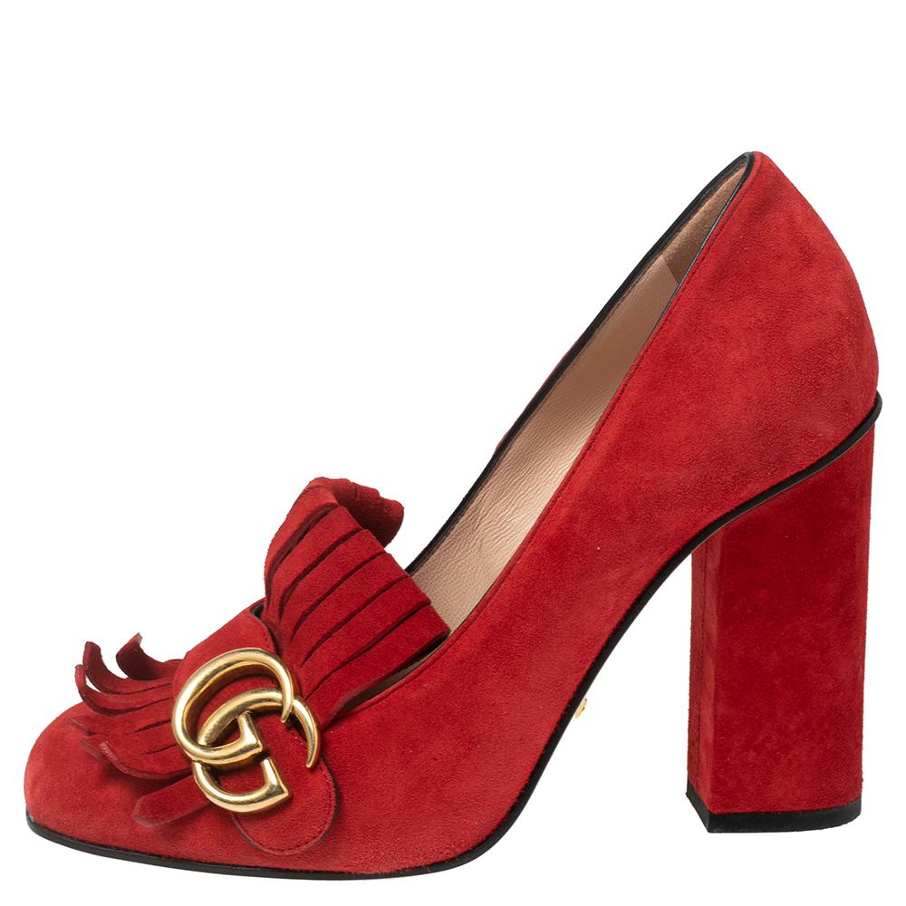 This pair of pumps by Gucci is a buy to wear and treasure. They've been crafted from suede and styled with folded fringes and the brand's signature GG logo on the uppers. Square toes and a set of block heels complete the pair.

Includes: Original