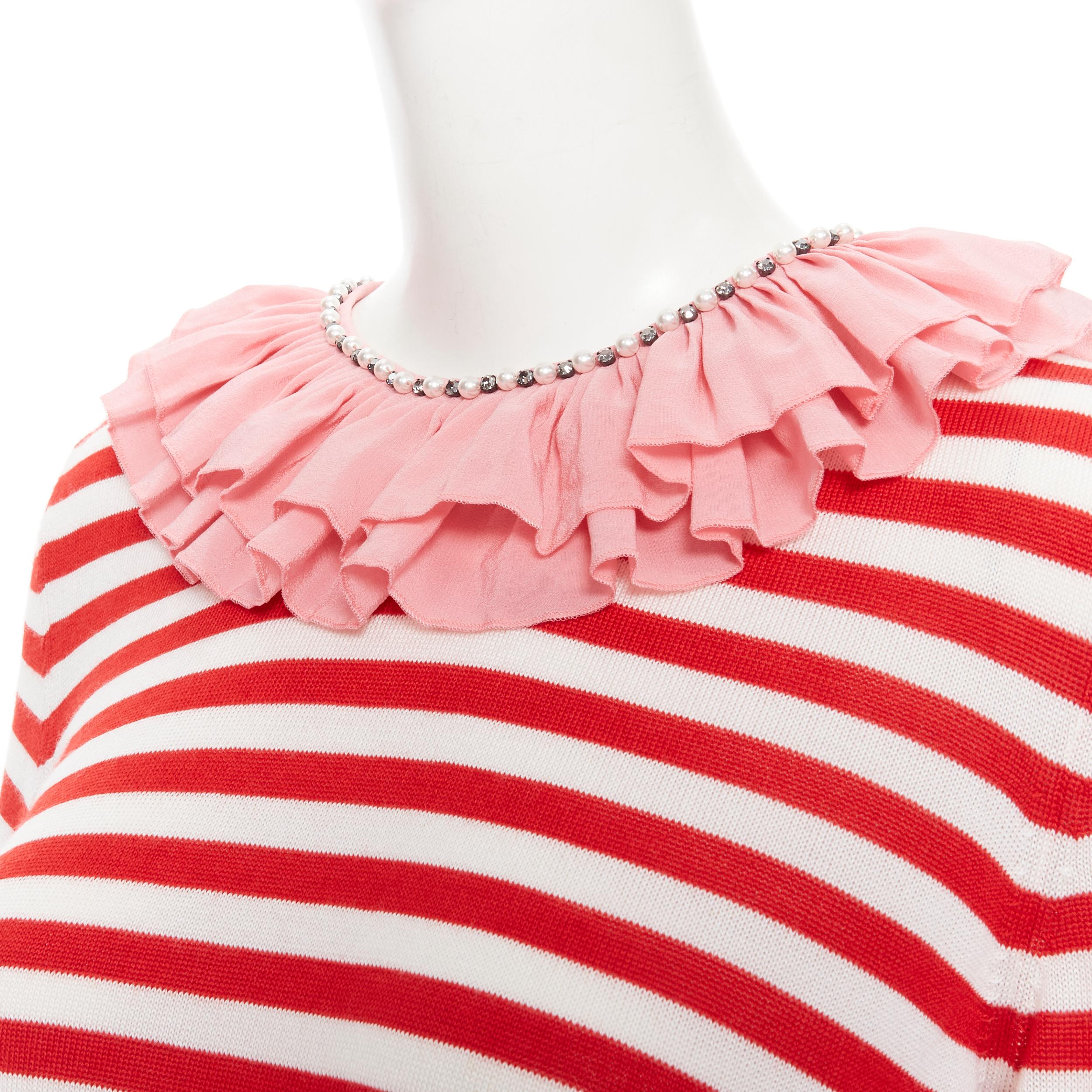 GUCCI red white stripe pink silk trimmed pearl crystal collar sweater L 
Reference: TGAS/B01649 
Brand: Gucci 
Designer: Alessandro Michele 
Material: Silk 
Color: Red 
Pattern: Striped 
Closure: Zip 
Extra Detail: Zip closure at nape. Pearl and