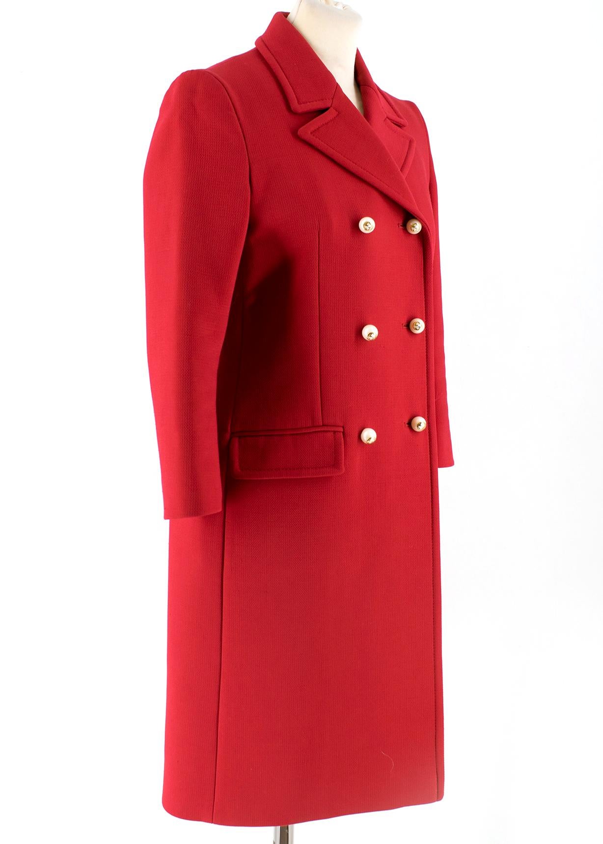 Gucci coat in red wool and polyamide mix. Double-breasted with pearl buttons feature the GG logo in gold.  RRP £2200.00


- 73 % wool, 25% Polyamide, 2% Elastane 
- Lining: 52% Acetate, 48% Viscose 
- Front patch pockets with flaps
- Made in