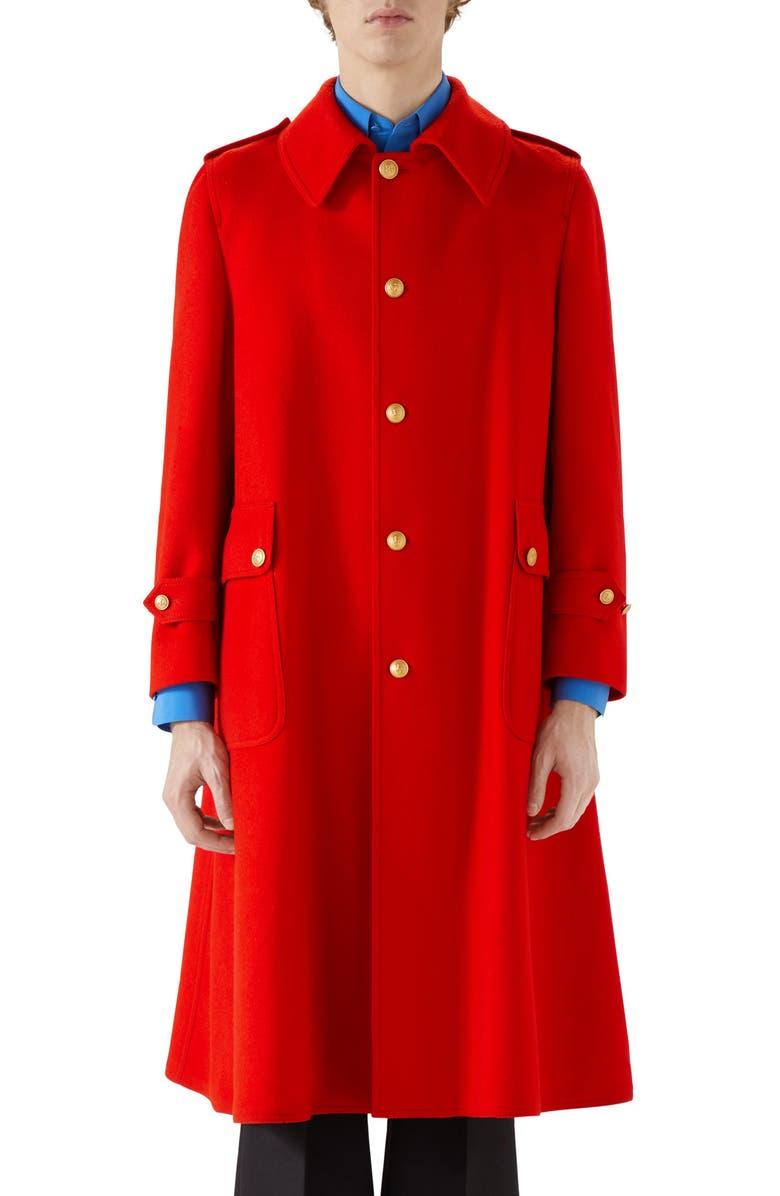 100% authentic Gucci oversized red wool (100%) coat featuring gold-tone Sagittarius metal buttons. Lined in burgundy viscose (100%) with two interior chest pockets. Point collar and flap patch pockets with buttons. Shoulder epaulets and strap