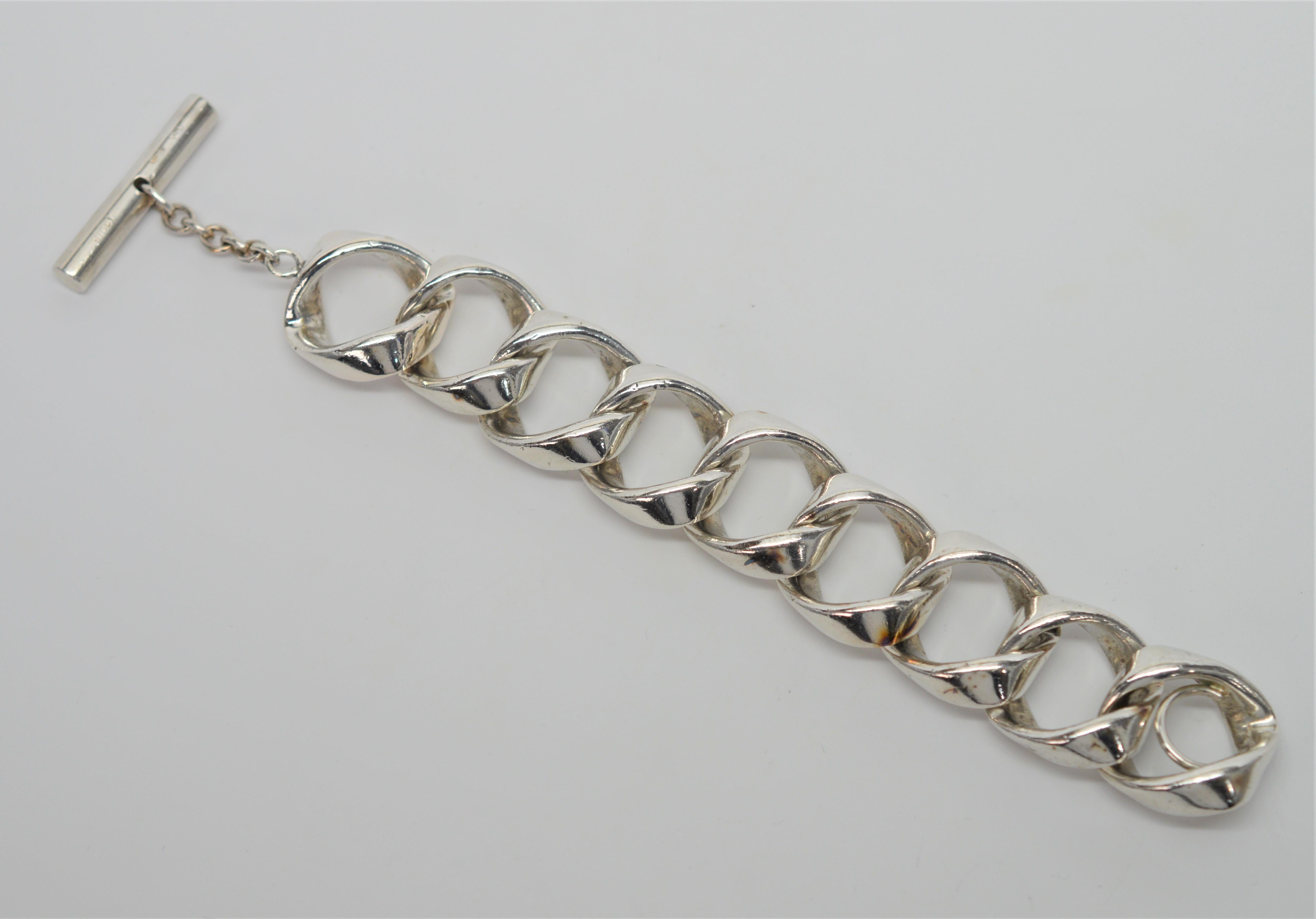 Bold, heavy weight Gucci 1950's Style Sterling Silver Chain Bracelet. Signed by Gucci, this retro statement piece is serious in size and weight and not for the faint at heart. This bracelet length is seven inches with a toggle closure. Showing some