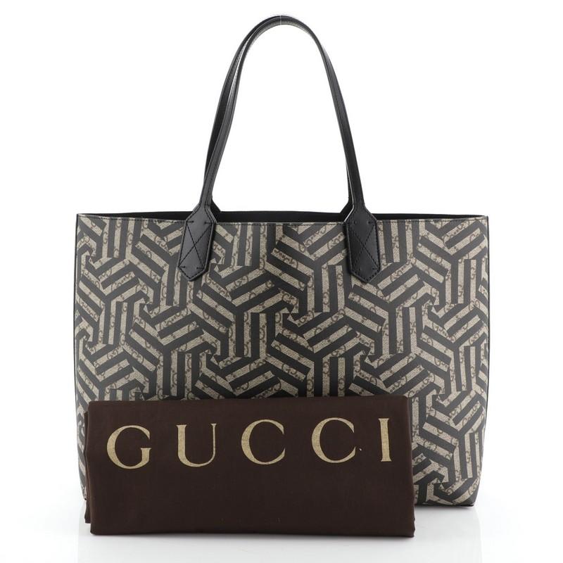 This Gucci Reversible Tote Caleido GG Print Leather Medium, crafted in brown Caleido print leather, features dual slim handles. It opens to a black leather interior. 

Estimated Retail Price: $1,250
Condition: Very good. Wear on base corners,