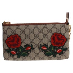 	Gucci Rose Clutch Bag with GG monogram print and gold chain strap