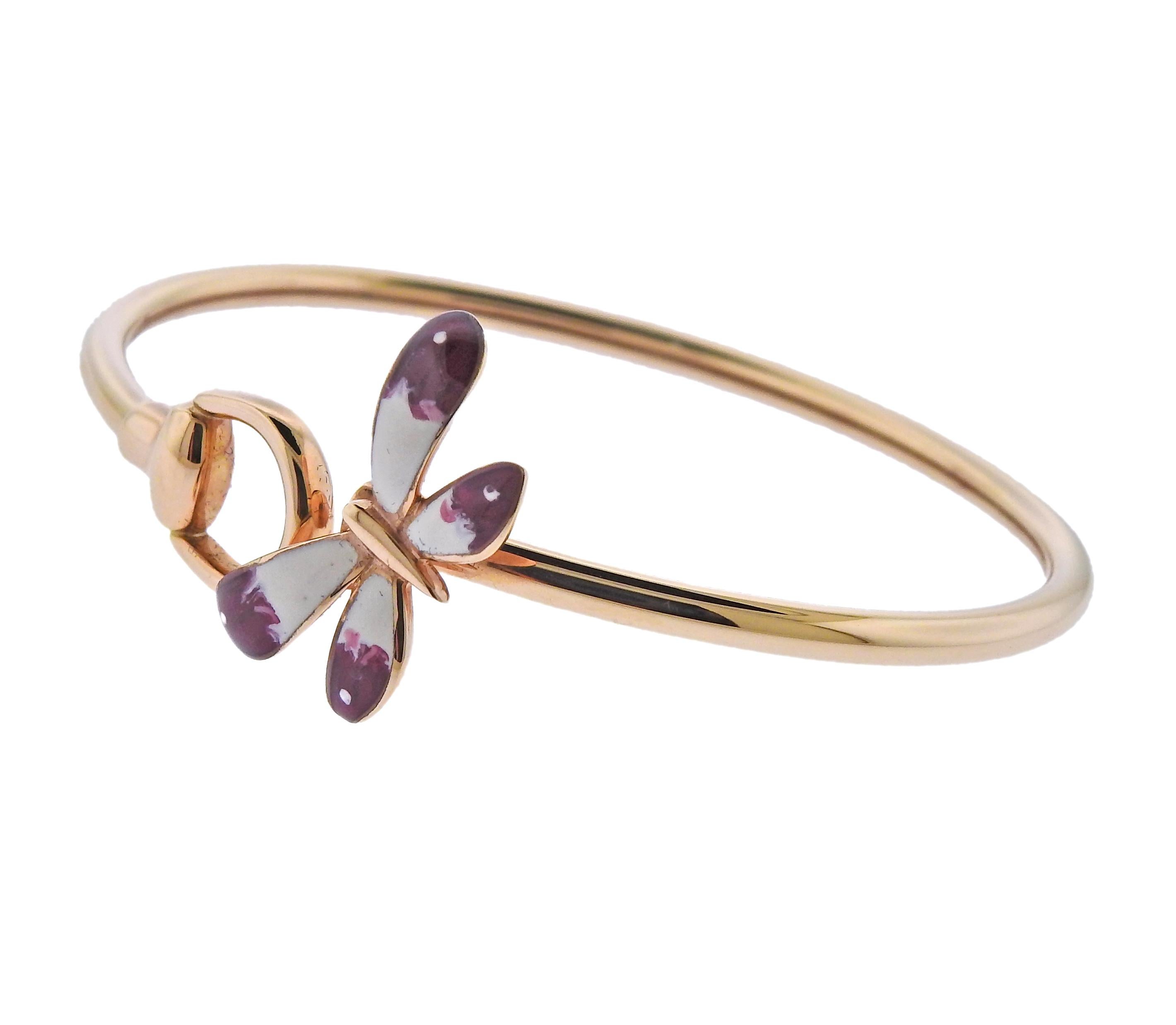 18k Rose gold bracelet crafted by Gucci. Set with enamel on the butterfly. Retail is $2,275.  Inside measures 47mm x 56mm, will comfortably fit 7