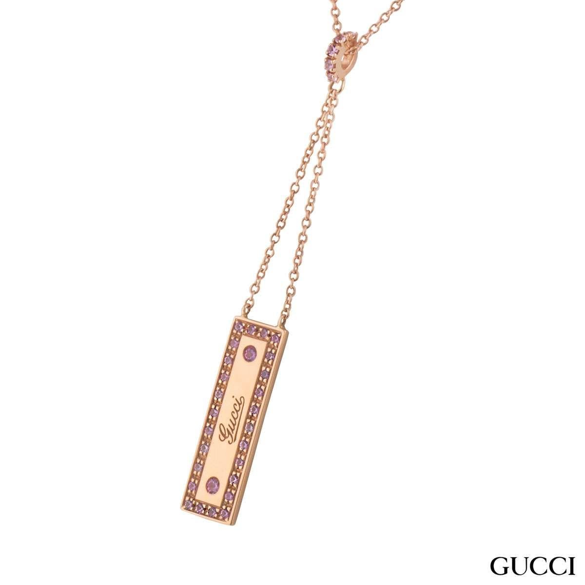 A beautiful 18k rose gold spinel Gucci pendant. The pendant comprises of a rectangle motif with 'Gucci' logo embossed in the centre. The logo has a box around set with pink spinel gemstones with a weight of approximately 0.25ct, with a pink hue