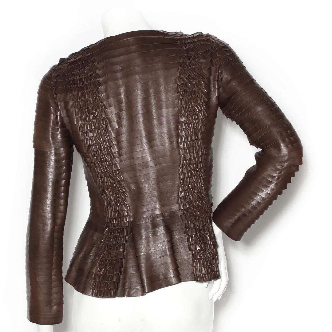 Gucci Leather Jacket 
Made in Italy 
Brown leather 
Tiers of leather ruffles throughout jacket 
Ruched details 
Rounded neckline 
Zipper down front of jacket 
Lined in brown silk 
Excellent condition; Preloved with no visible signs of wear or use.