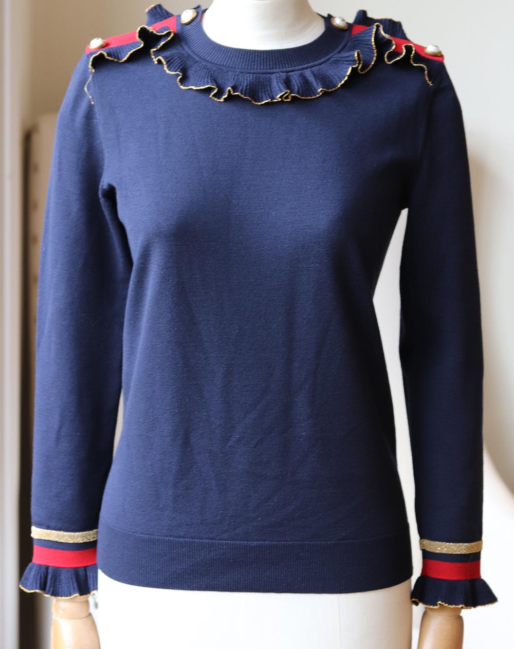 Gucci's sweater is spun from soft navy merino wool, blended with a hint of stretch for comfort. 
It has a lovely ruffle collar, Renaissance-inspired gold-trimmed ruffles and contrasting red stripes.
Navy, red and gold merino wool-blend.
Slip on.
93%