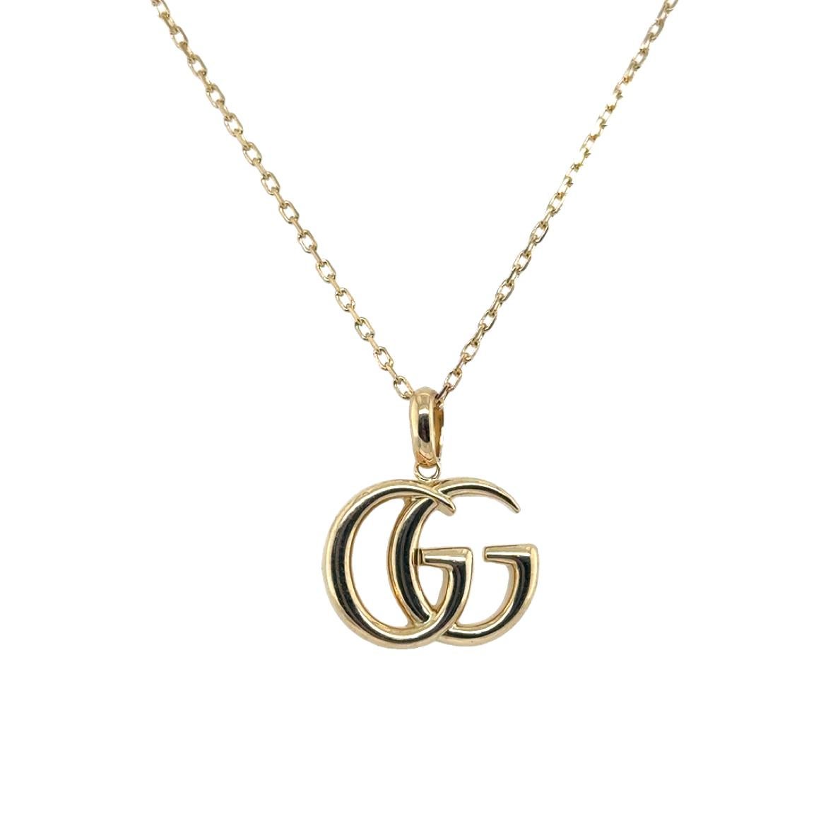 Gucci, collier pendentif Running GG en or jaune 18 carats Excellent état - En vente à MIAMI, FL