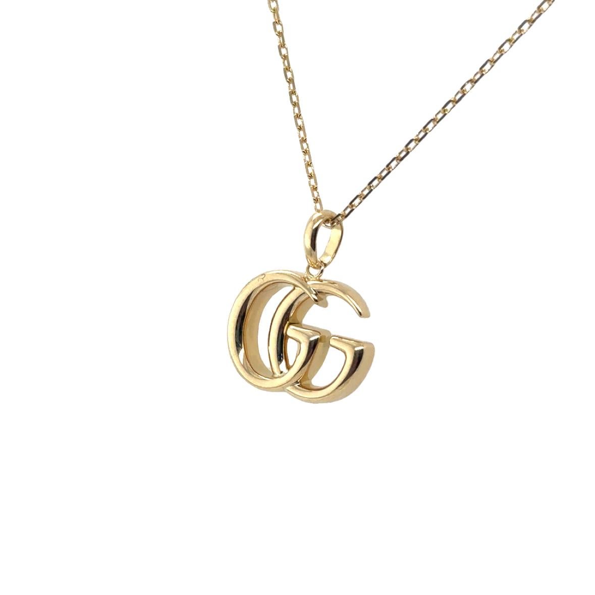 Gucci, collier pendentif Running GG en or jaune 18 carats en vente 1