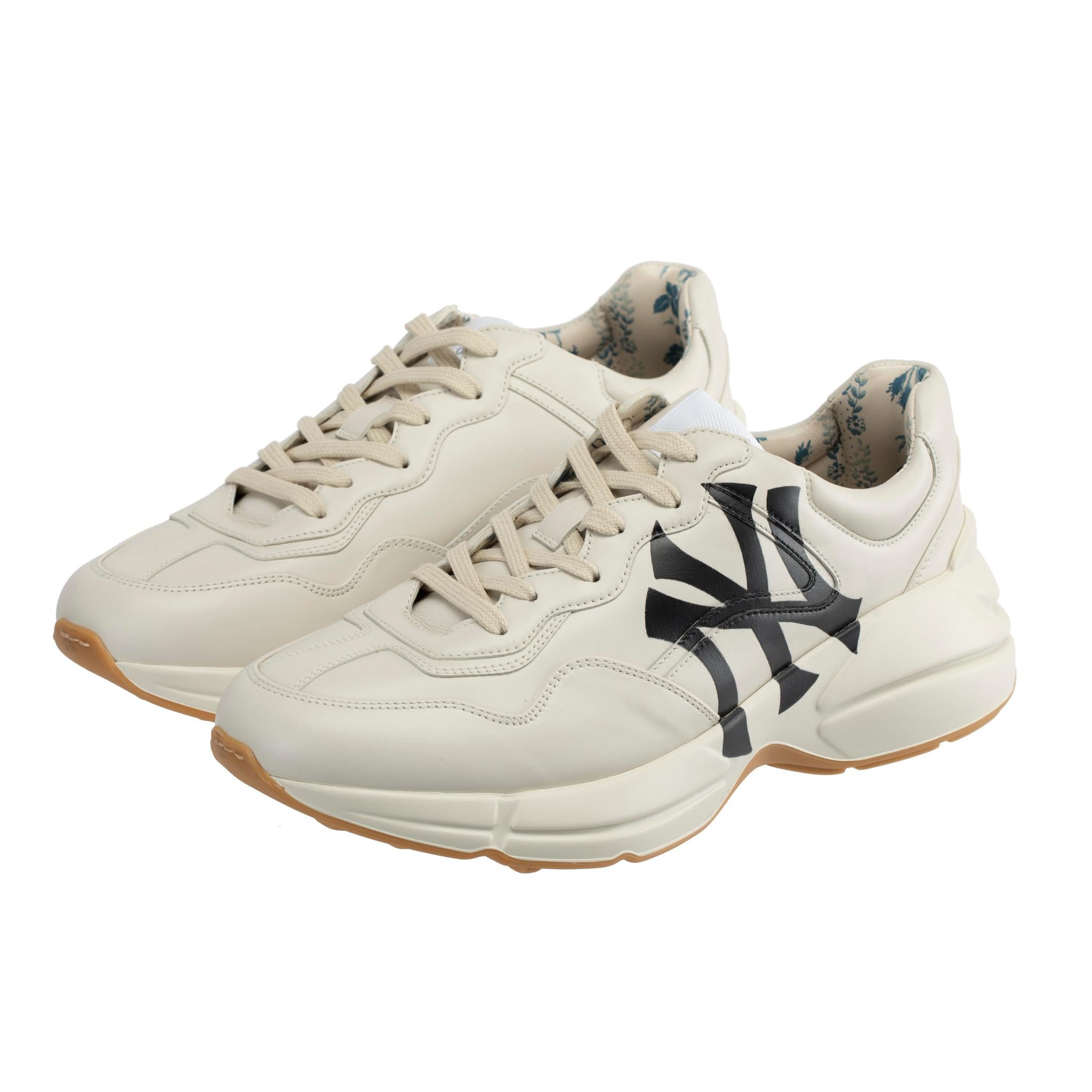 Brand:

Gucci

Product:

Rython Sneaker With NY Yankees Logo

Size:

7.5 US

Colour:

Off-White

Material:

Smooth Leather

Condition:

Pristine; New Or Never Worn

Accompanied By:

Gucci Box, Two Gucci Dustbags, Tag & Card

*Please note box is