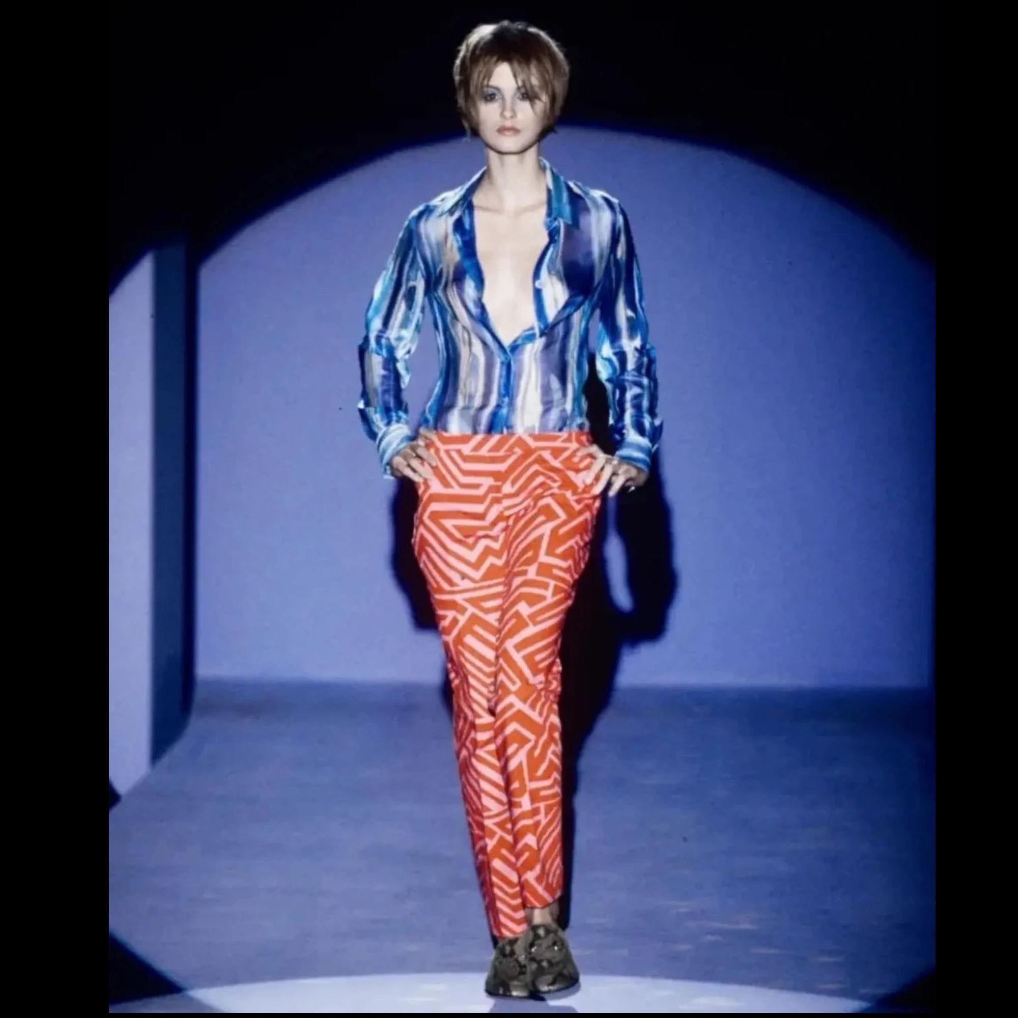 GUCCI
S/S 1996 by Tom Ford Abstract Colour Printed Silk Sheer Shirt

a sheer silk button-up top designed by Tom Ford for Gucci's Spring/Summer 1996 collection. This 1970s-inspired collection featured the same blouse in blue in the runway