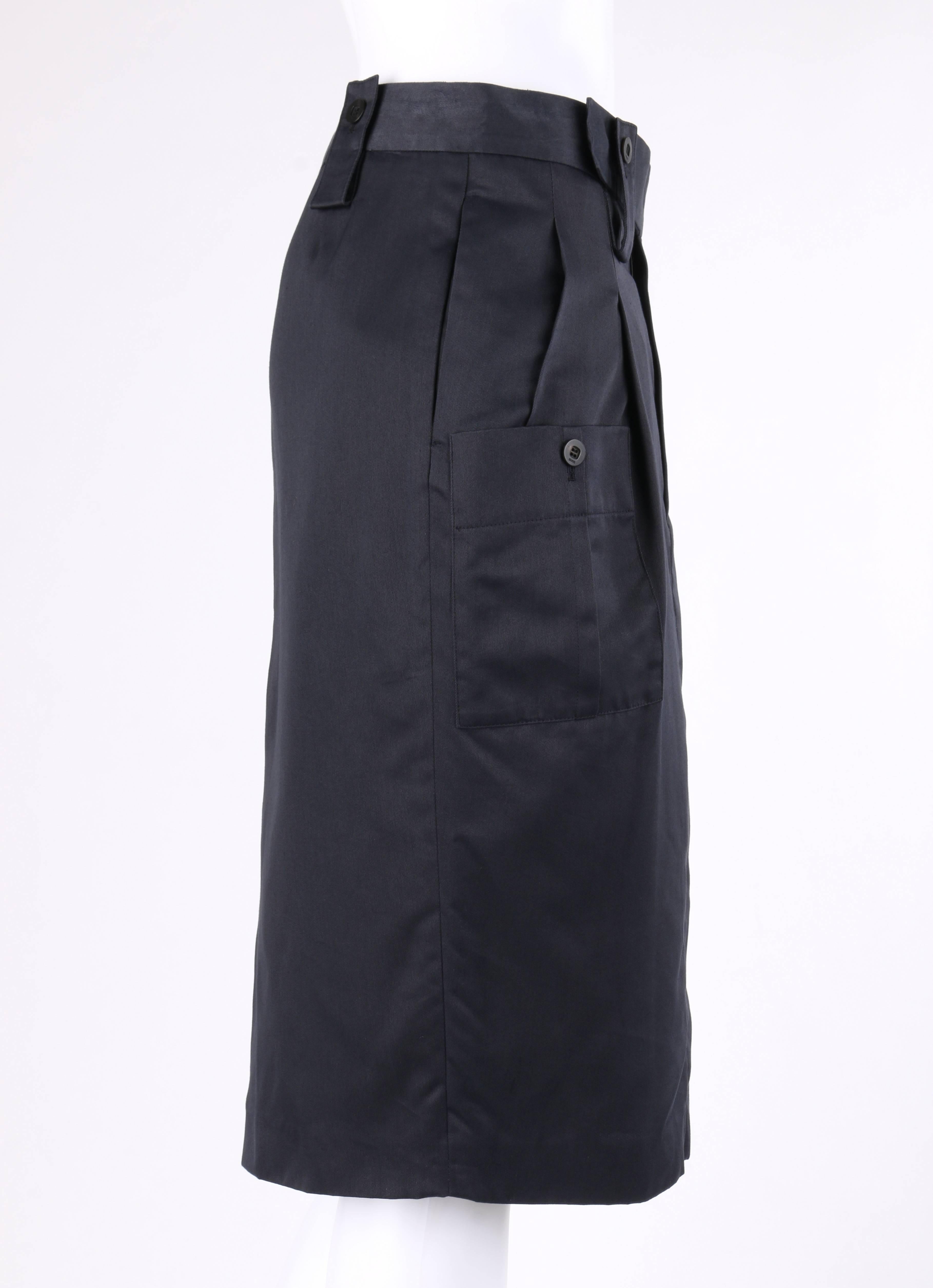 Gucci Spring / Summer 2001 navy blue silk twill cargo pocket pencil skirt; new with tags. Runway look #31 designed by Tom Ford. Banded waistline. Four belt loops with single button closures. Center front zip fly with two hook and bar and single