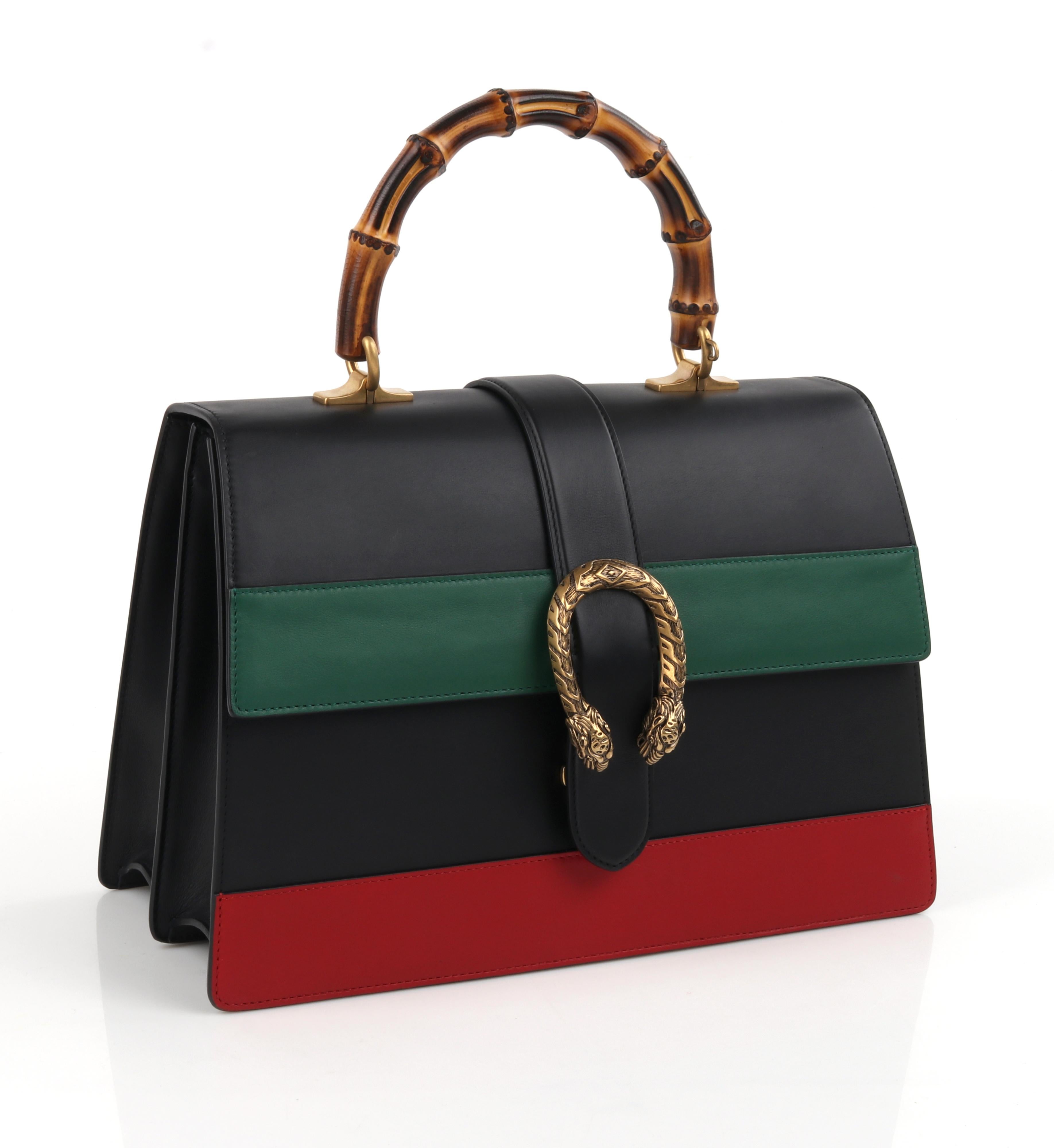 GUCCI S/S 2016 “Dionysus” Large Green Red Black Striped Bamboo Top Handle Bag NWB
 
Estimated Retail: $3,700.00
 
Brand/Manufacturer: Gucci 
Collection: S/S 2016 - Runway Look #11
Designer: Alessandro Michele 
Style: Top-handle bag
Color(s): Black,