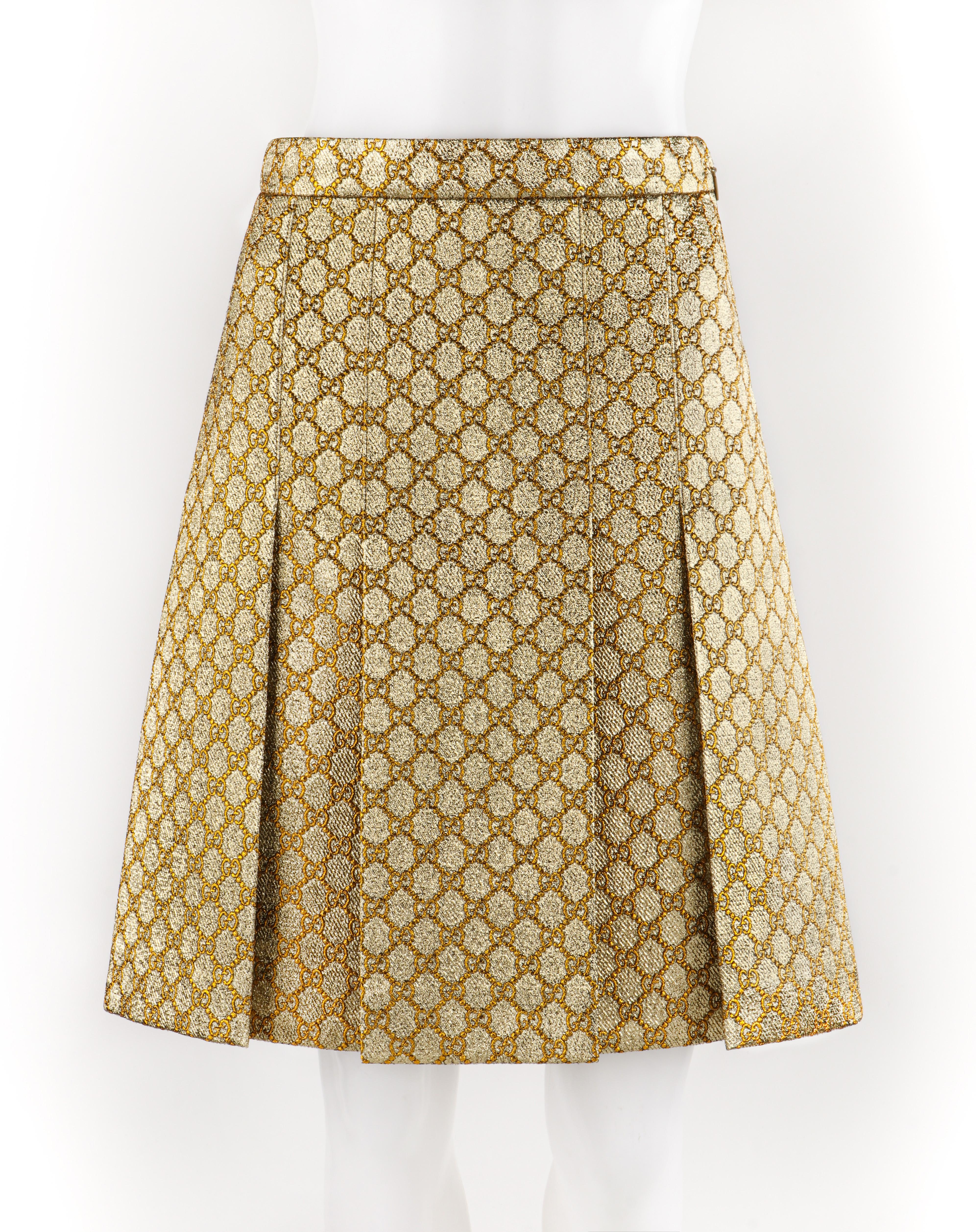 GUCCI S/S 2018 Gold Metallic Brocade Monogram Logo Pleated Knee Length Skirt
 
Brand / Manufacturer: Gucci
Collection: S/S 2018
Style: Pleated Skirt
Color(s): Shades of gold
Lined: Yes
Marked Fabric Content: 34% metallized polyester, 22% cotton, 20%