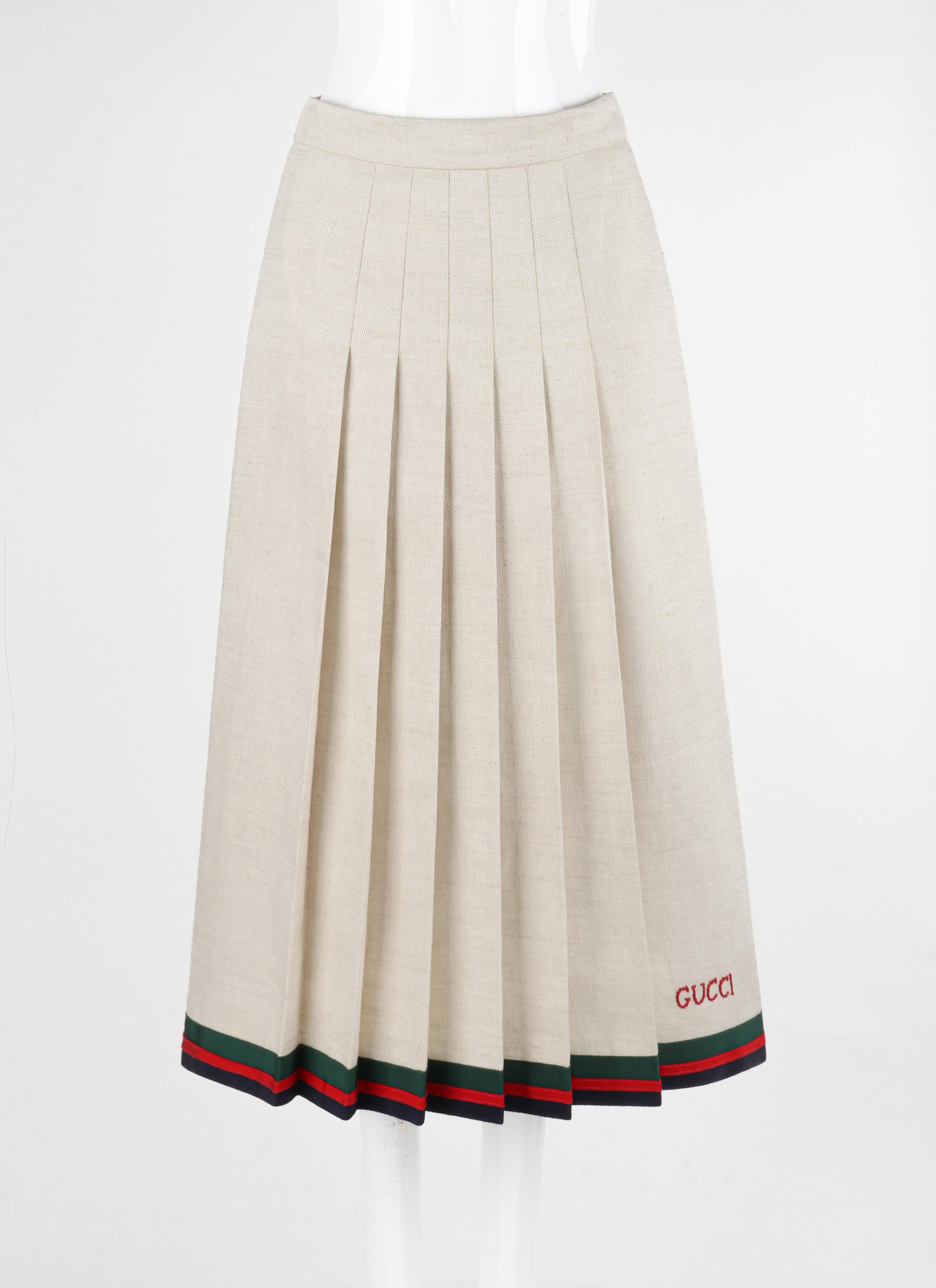 Gucci S/S 2018 Ivory Linen & Silk Pleated Embroidered Equestrian Web Midi Skirt

Brand / Manufacturer: Gucci
Collection: S/S 2018
Designer: Alessandro Michele
Style: Midi Skirt
Color(s): Shades of ivory (oatmeal). Trim: Green, red, blue
Lined: