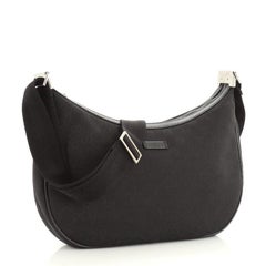 Sac de messager Gucci en toile GG medium avec fermeture éclair
