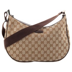 Sac de messager Gucci en toile GG medium avec fermeture éclair pour selle