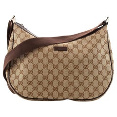 Sac de messager Gucci en toile GG medium avec fermeture éclair pour selle