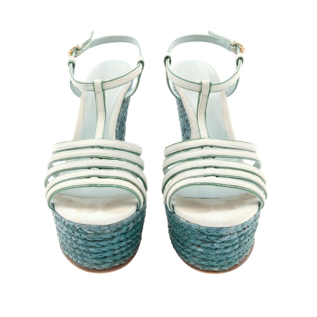 Gucci platform espadrille sandals in pastel green with braided raffia heels.

Suede cage upper and ankle straps, featuring a contrasting dark green leather edge finish.

Condition Details: Good, used condition. Shows minimal signs of wear, some