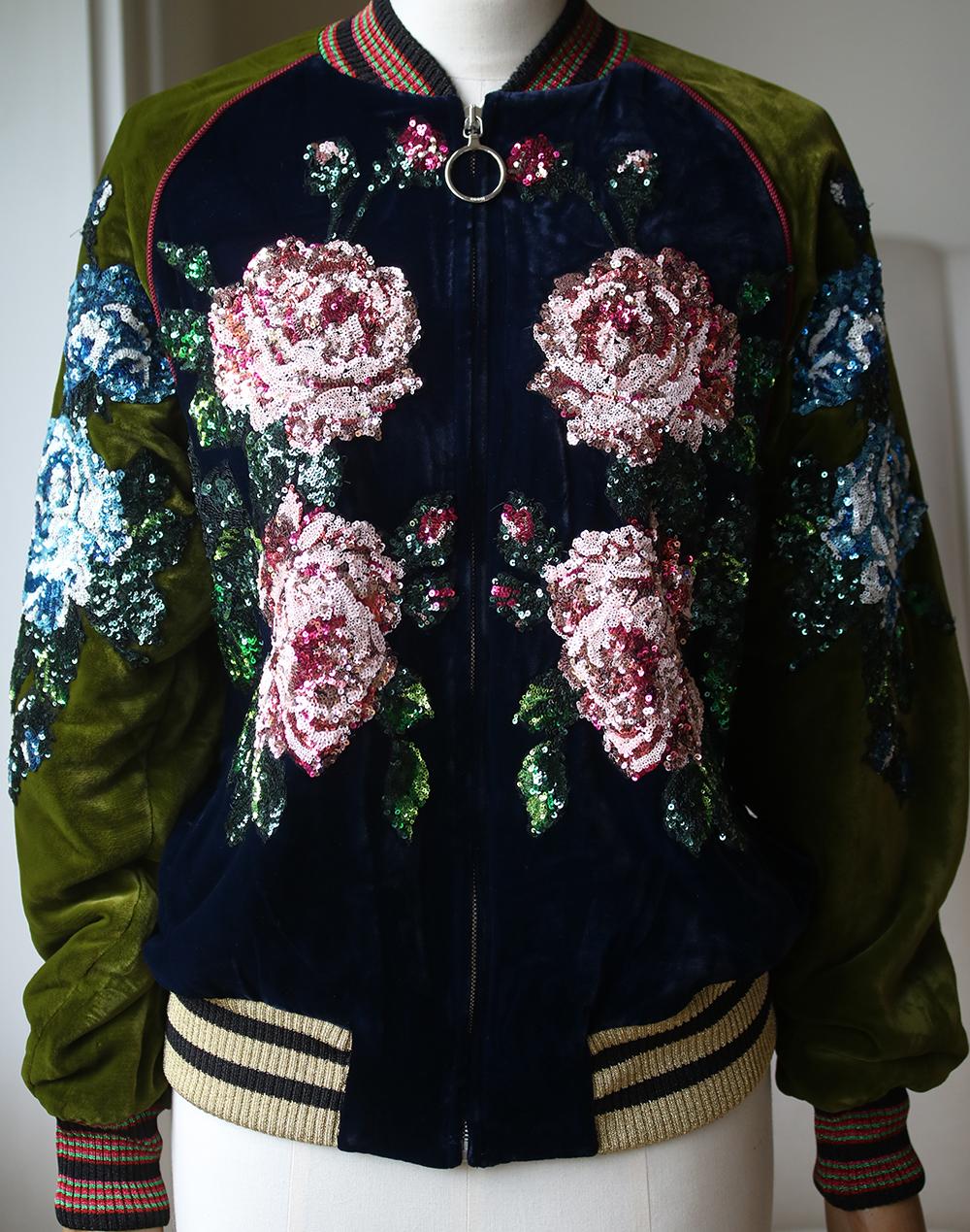 Add a dash of Gucci glamour to your wardrobe with this sequin floral detailed bomber jacket. From the Autumn Winter 2017 collection, this bomber jacket is crafted from a luxury Italian silk blend and features a panelled colour block design and an