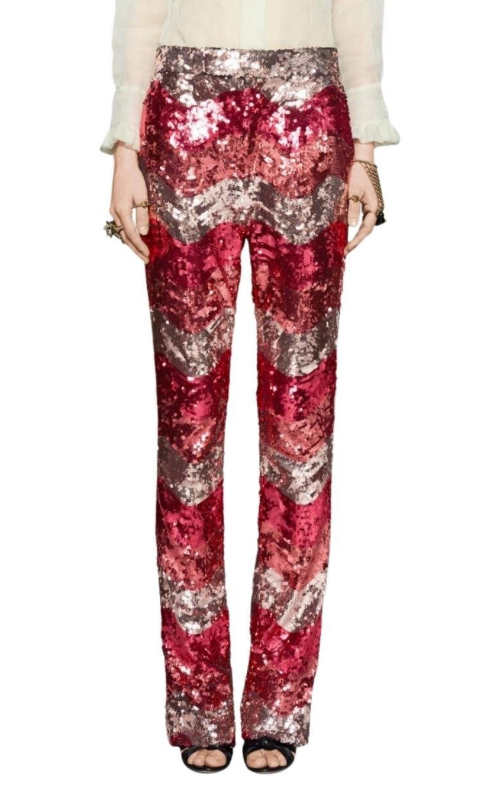 These straight leg pants bring the coral snake to life in allover alternating colors of sequins.
The sequins used are produced by a historic Italian company.
Black nylon tulle with alternating colors of sequins.
Menswear style, straight long