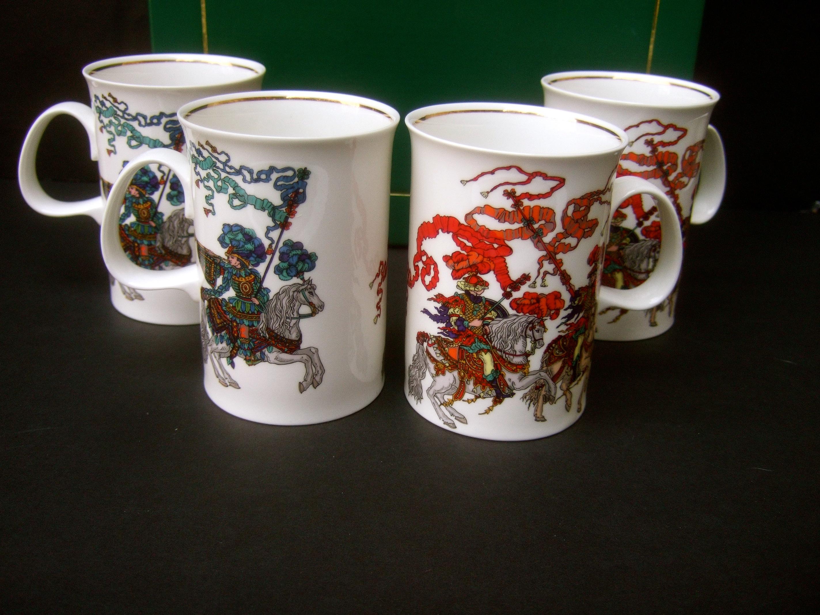 Gucci Set of four English bone China mugs in Gucci cardboard presentation box c 1980

The four porcelain mugs are embellished with enamel stenciling that depicts English knights mounted on their horses
The stenciled scenes depict a different scene