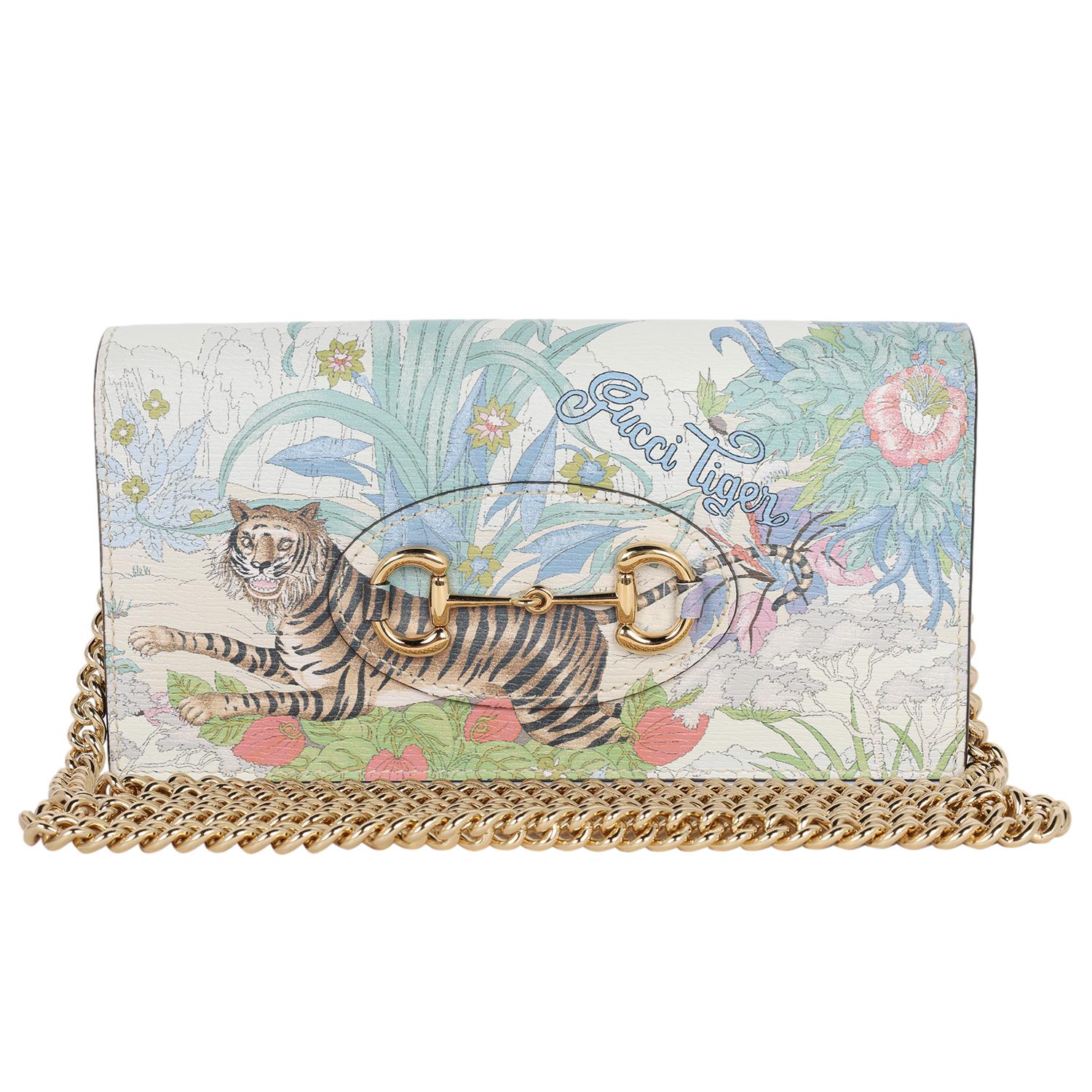 Authentic, NEW Gucci Shangai Calfskin Tiger Savanah Mini Horsebit 1955 Wallet on a Chain Bag. There are many reasons I love this bag; first and foremost is the Tiger and floral print, which is featured on both the front and back of the bag. The
