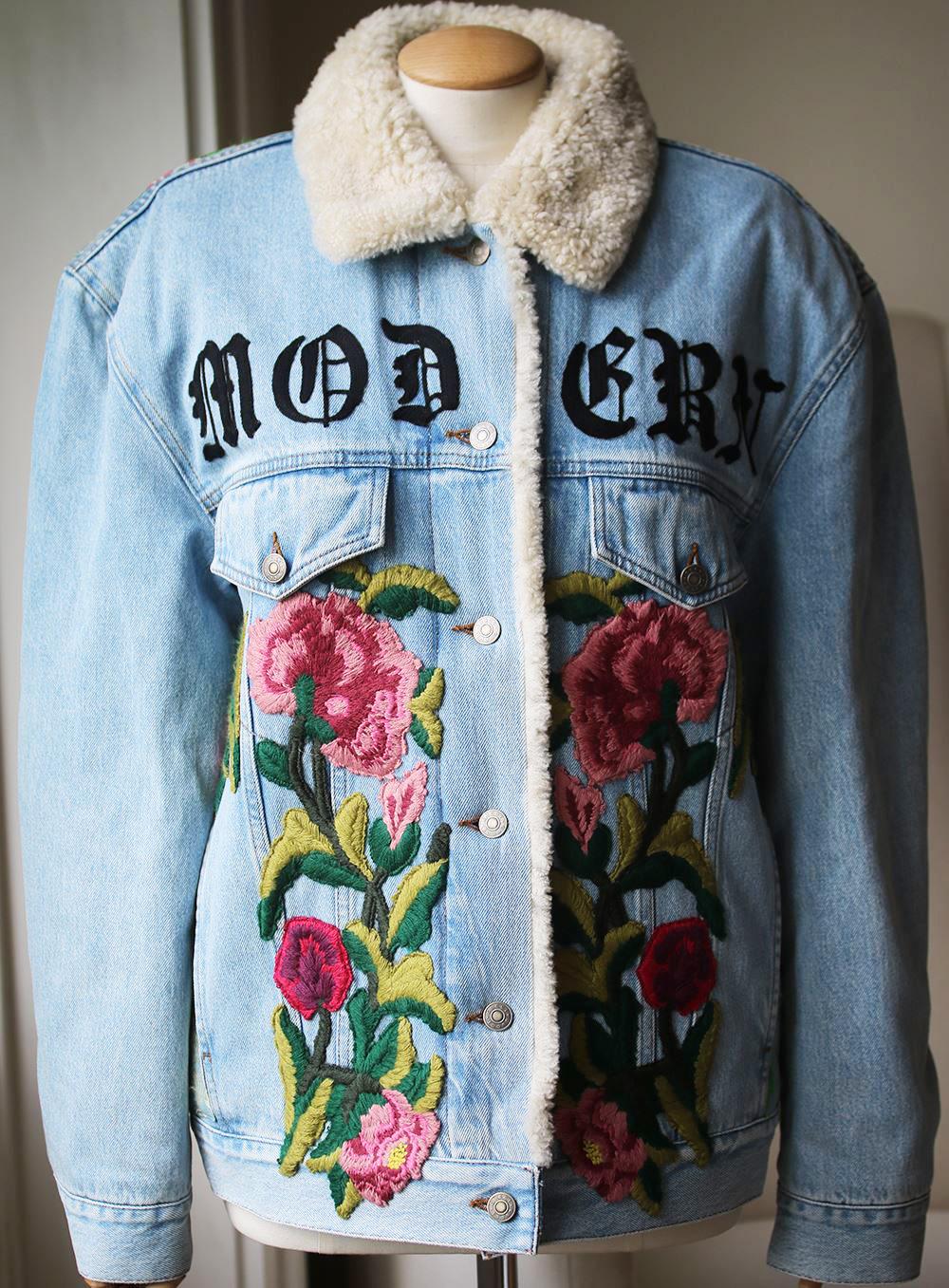 Gucci's oversized shearling-lined denim jacket has a cool, customized look.
The jacquard panel at the back is intricately embroidered by hand with florals and a flaming mythical creature - each piece takes an artisan hours to complete. 
Light-blue