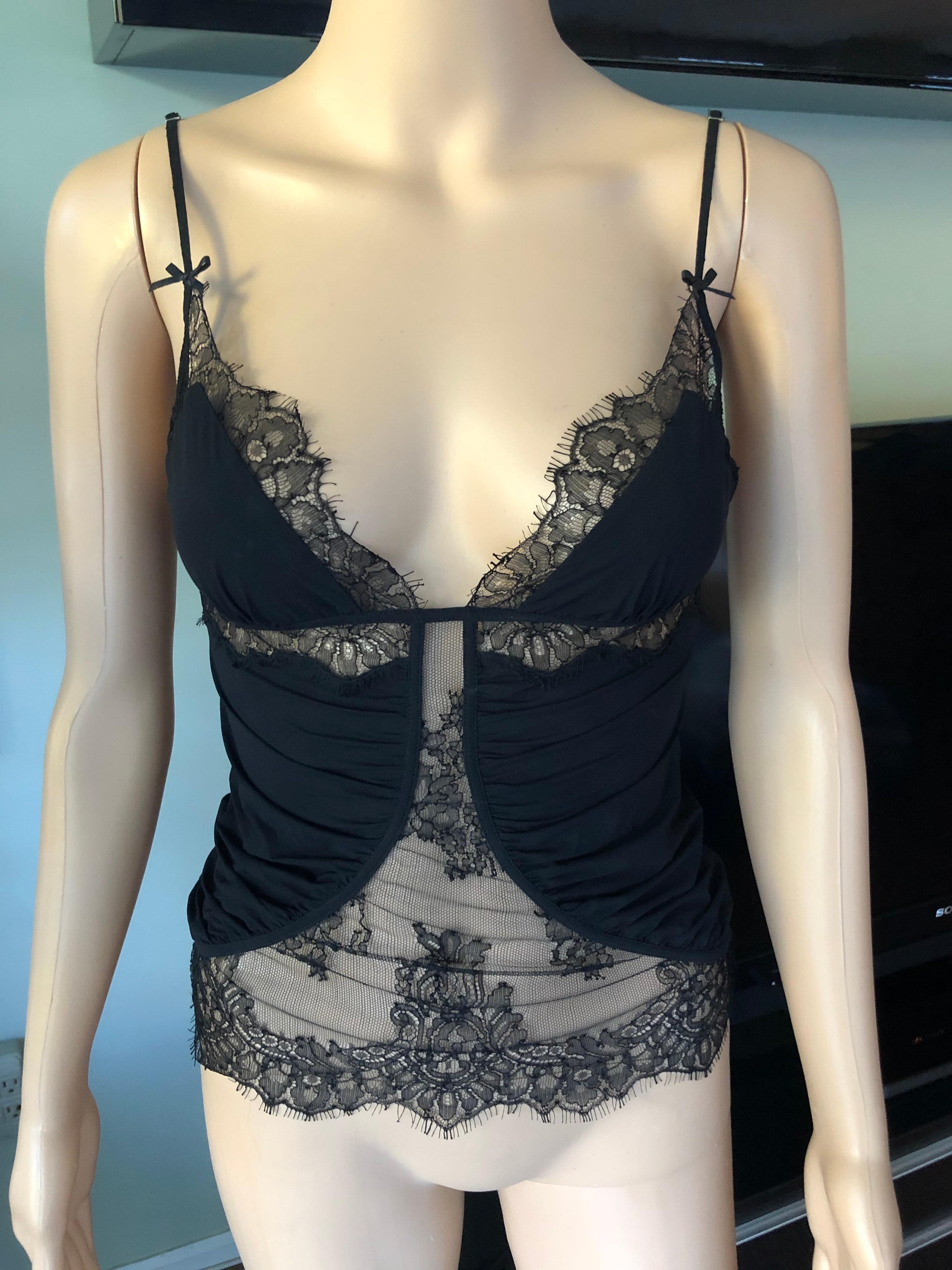 Gucci Sheer Lace Panels Black Top Size S

Gucci sexy black top featuring plunging neckline and sheer lace accents throughout.
