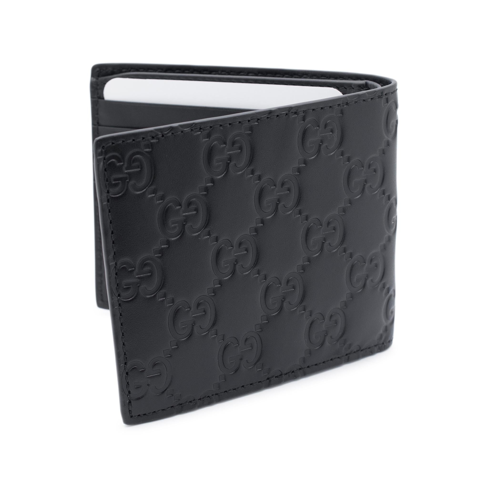 Brand: Gucci

Gender: Unisex

Metal Type: Leather

Width: 4.00 Inches

Height: 3.50 Inches

Depth: 0.50 Inches

Weight: 67.36 Grams

This folded calf leather wallet features the iconic Gucci Signature GG pattern and a sleek black design. Keep your