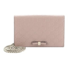 Portefeuille Signature Gucci sur chaîne en cuir Guccissima
