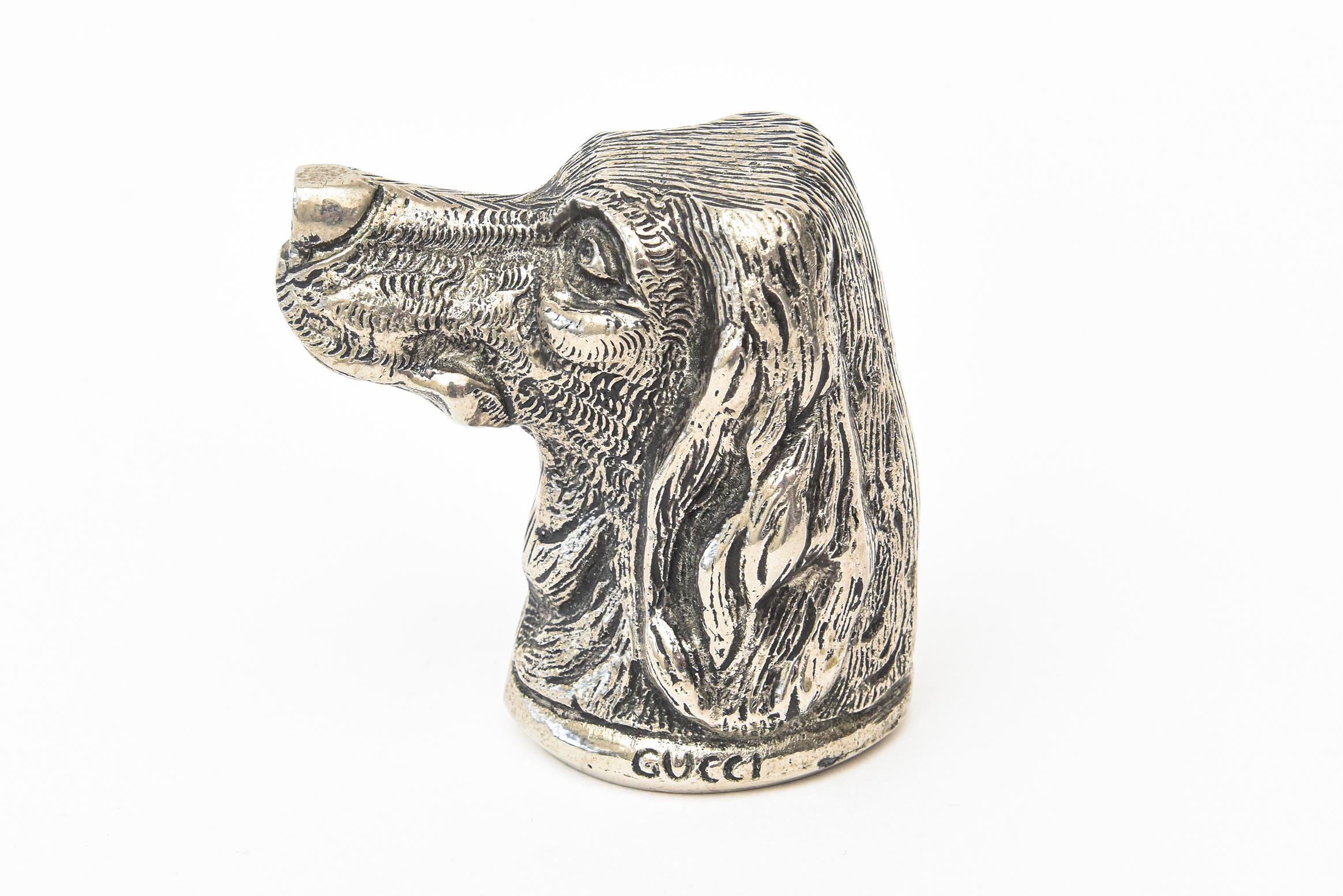 This delightful vintage Italian signed Gucci dog head bottle opener is from the 1970s. It is silver-plate. This one in particular is more desirable than other animals. The face is so sweet and who does not love a dog? It is hallmarked Italy Gucci.