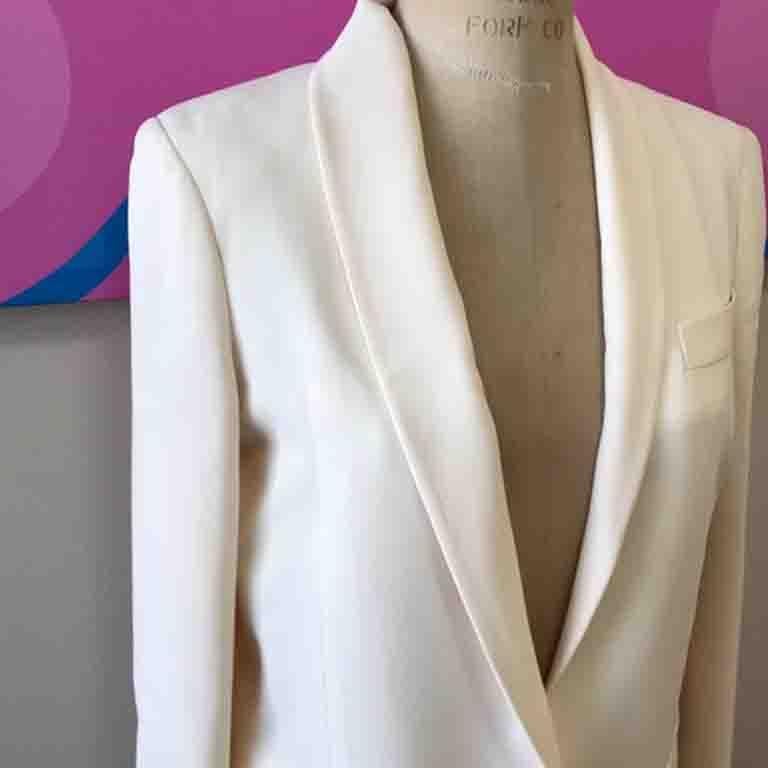 The perfect smoking or tuxedo jacket by Gucci ! Pair with black or winter white pants or skirt for a great look
Fragile color and this has just been dry cleaned but there is some sort of line at the top of one sleeve and a few random marks on the