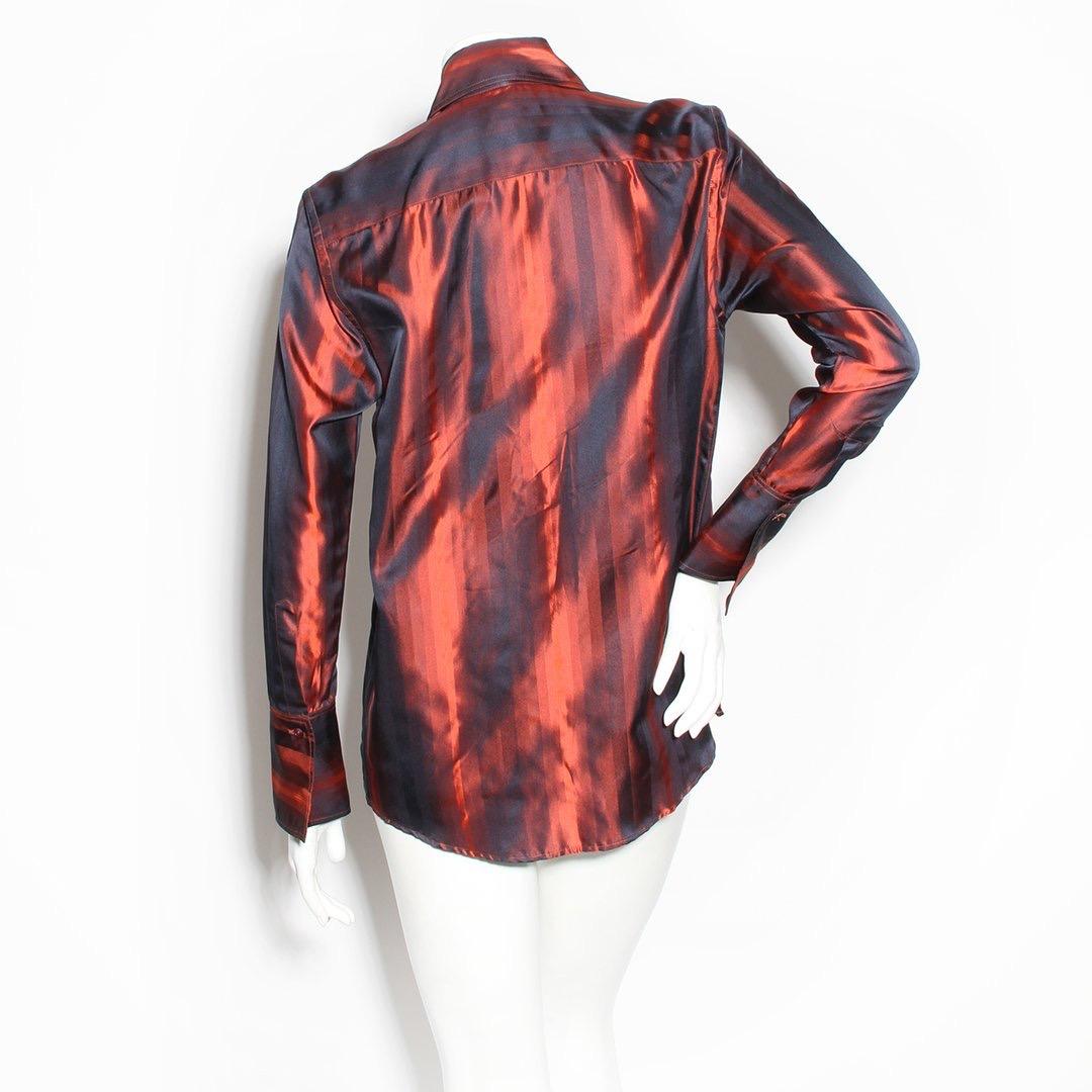 Silk stripe top by Tom Ford for Gucci
Fall/Winter 1997 RTW collection
Stripe long sleeve top
Red tones
Hidden button-front closures
Pointed collar
Button cuff closures
Made in Italy
Condition: Excellent, little to no visible wear. (see photos)
