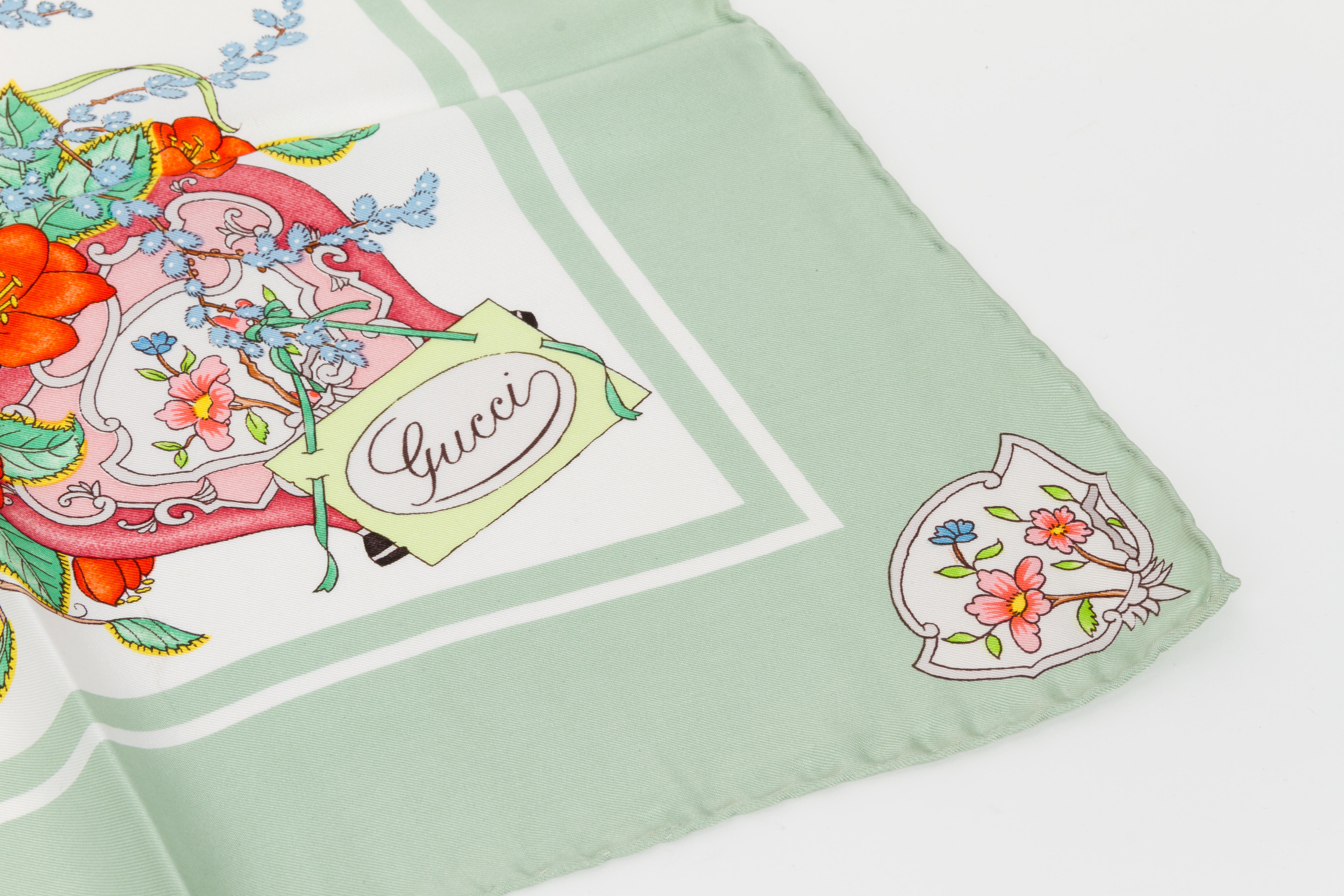 Gucci silk twill floral scarf with a sea foam border and hand-rolled edges. Accornero original and collectible design. Does not include box. Minor wear.