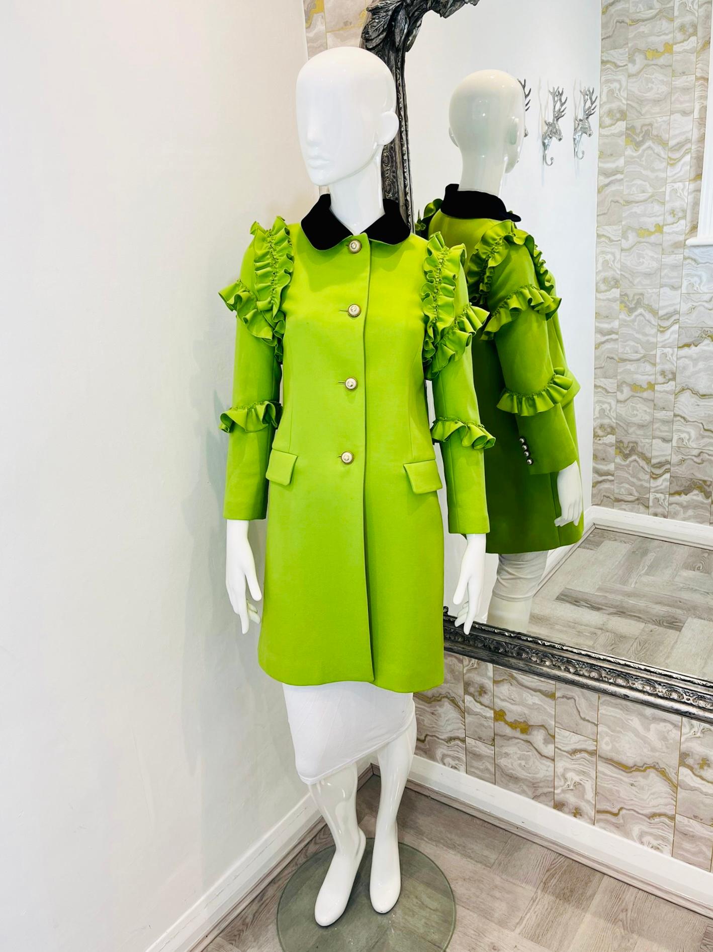 Gucci Silk & Wool Ruffle Trim Coat 

Runway collection 2017/18. Bright green coat with black velvet collar,

'GG' logo pearl buttons to closure and cuffs. Ruffle trim to shoulders

and arms. Rrp approx £3250.

Size - 40IT

Condition