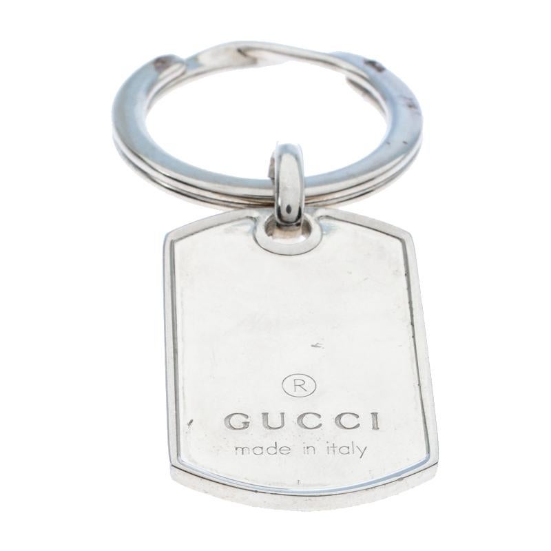 Gucci's key ring is a stunner of a creation. It is made from silver and we can't help but admire its fine finish and simple design. It has a key ring and a tag engraved with the brand name. Stylish and functional, this piece is worth the