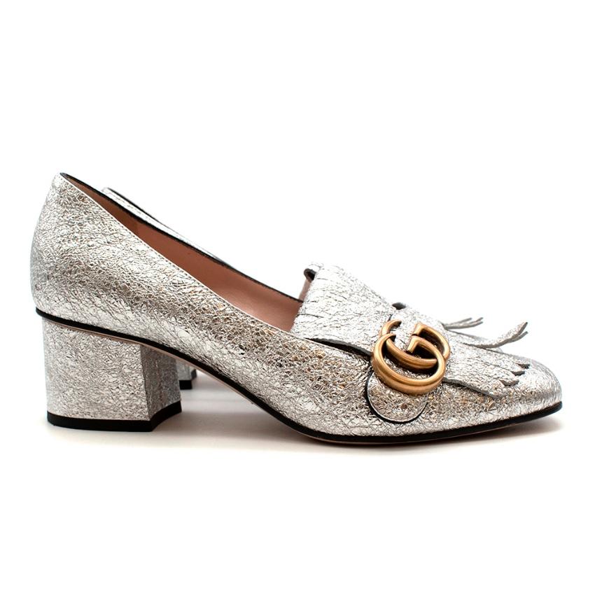 Gucci Silver Leather GG logo Mid-heel Pumps with Fringe 

-Iconic GG Marmont golden hardware 
-Luxurious silver leather with a cracked effect 
-Fold over fringe detail
-Chunky mid-heel for comfort 
-Soft leather lining 
-Branded hardware to the