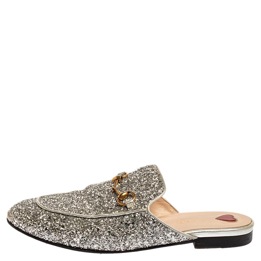 First introduced as part of Gucci's Fall Winter 2015 collection, the Princetown mules are an absolute favorite worldwide and have been worn by countless celebrities. These mules have been designed in silver glitter leather and detailed with the