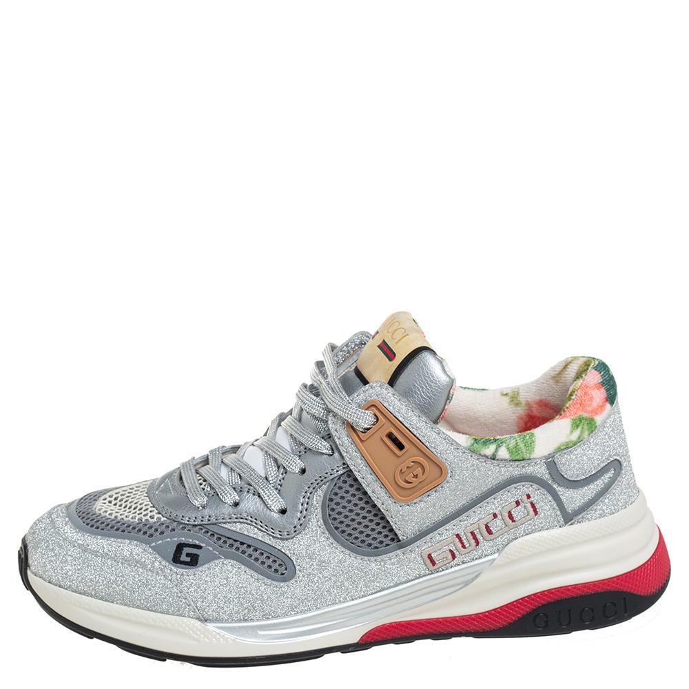 One's wardrobe is incomplete without a good pair of sneakers and what better than these Gucci ones! These Ultrapace sneakers have been crafted from glitter, leather, and mesh and styled with round toes, lace-up on the vamps, signature brand details