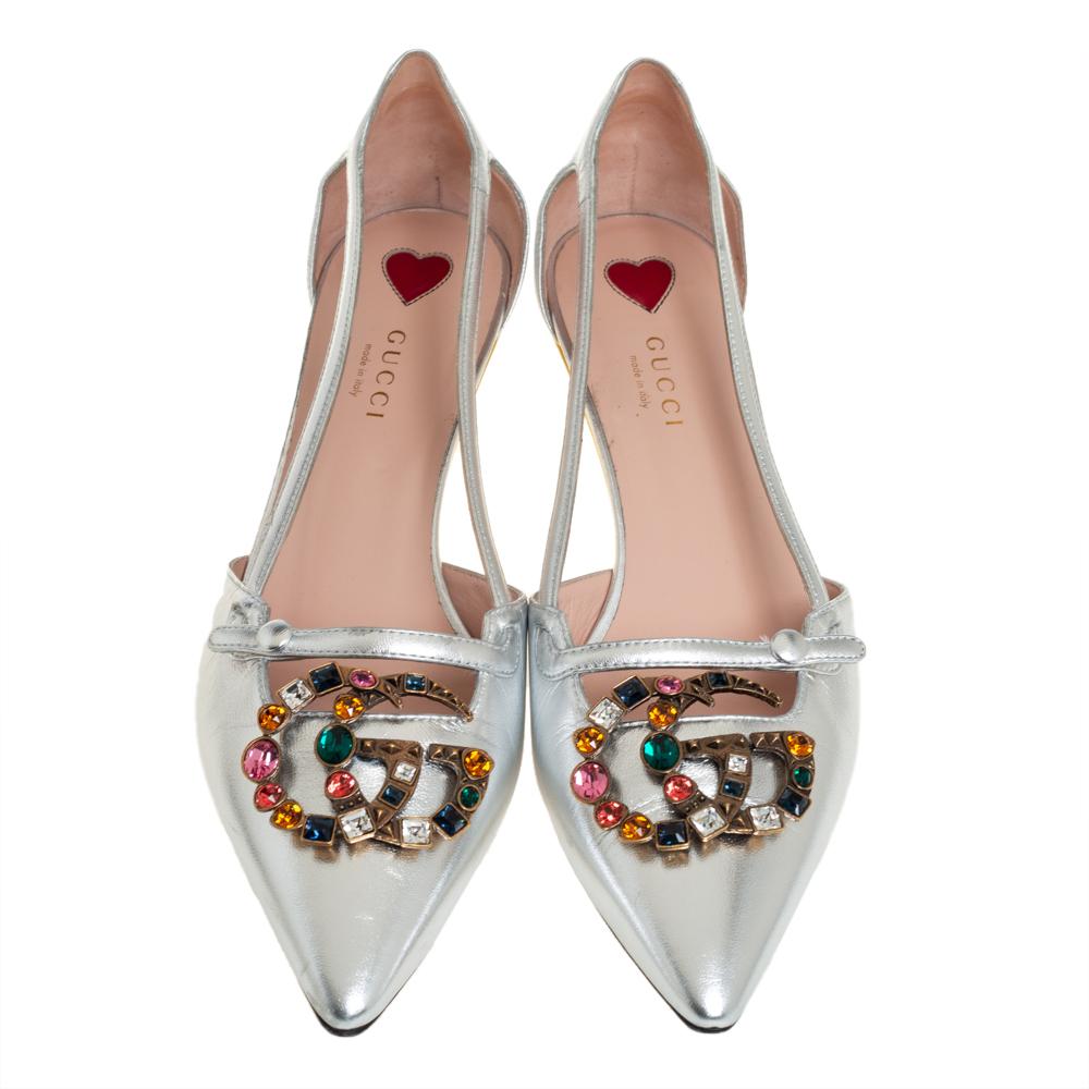 These pointed-toe Gucci pumps have come straight from a shoe lover's dream carry a feminine flair with sleek lines. Crafted from silver leather, they are adorned with crystal-embellished GG motifs and low bamboo heels.

Includes: Original Dustbag,