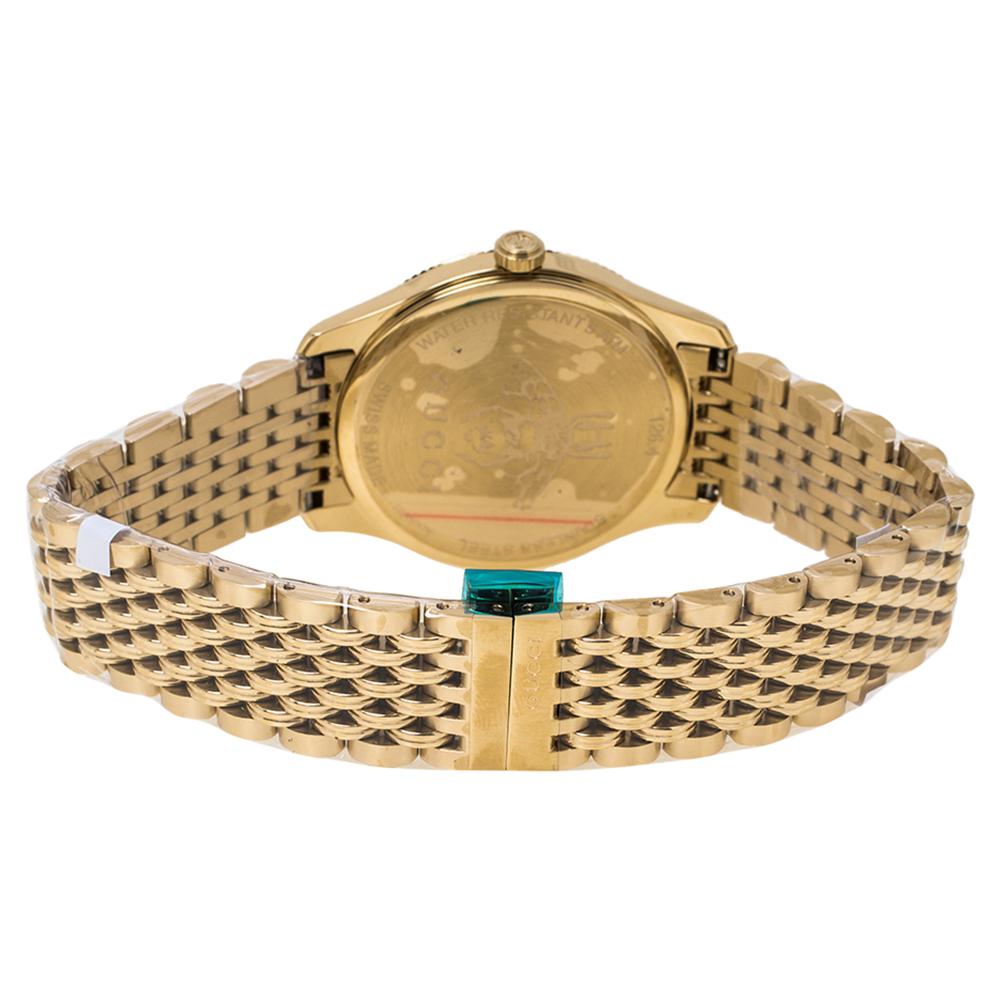 Gucci brings you this smart yellow gold PVD-coated stainless steel timepiece for you to flaunt on your wrist. Swiss made, it follows a quartz movement and carries a silver sunburst dial. The dial has the house's signature motifs as hour markers and
