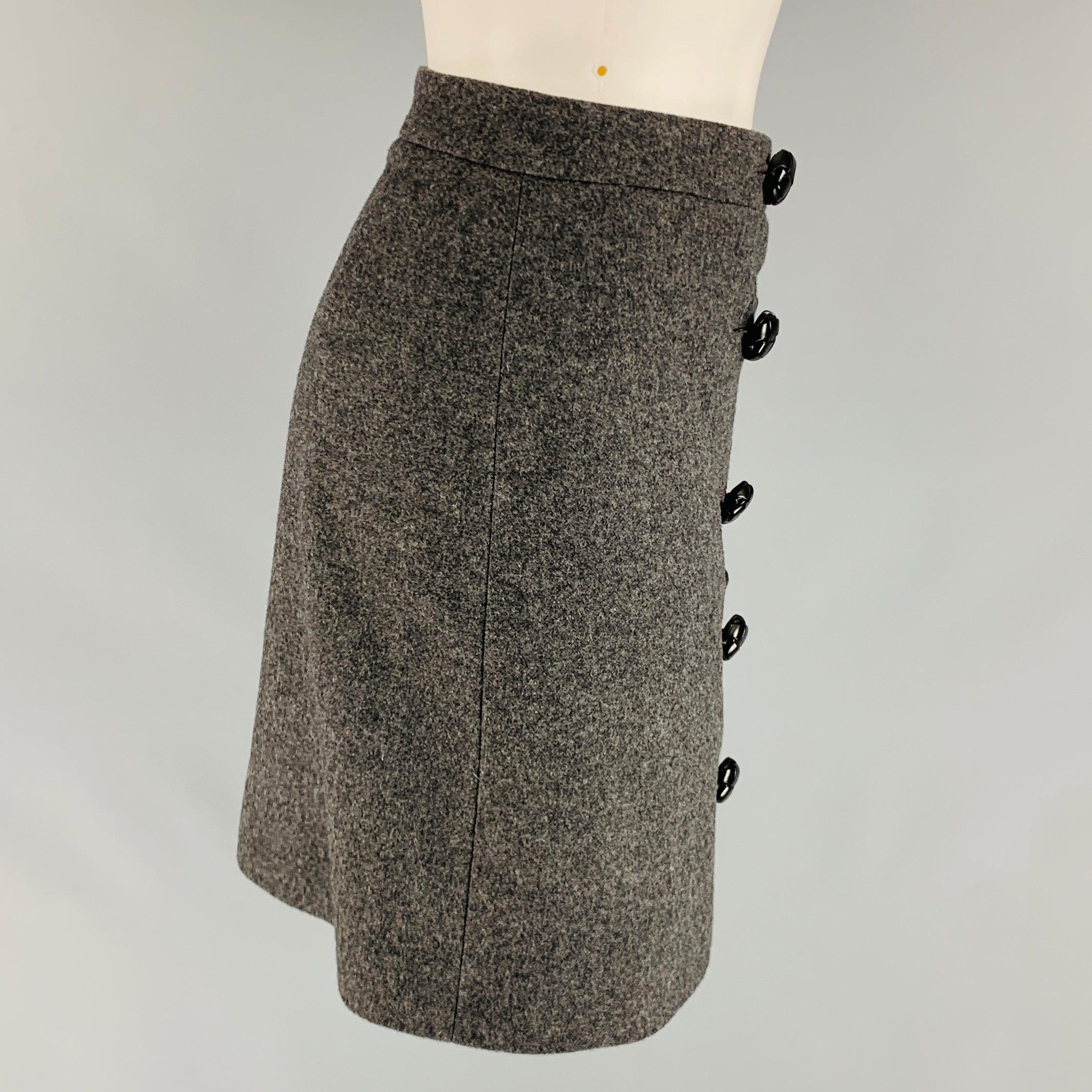 GUCCI mini skirt comes in a grey cashmere and wool featuring a
 front double breasted leather button closure. Made in Italy. Excellent Pre-Owned Condition. 

Marked:   36 

Measurements: 
  Waist: 27 inches Hip: 34 inches Length: 16 inches 
  
  
