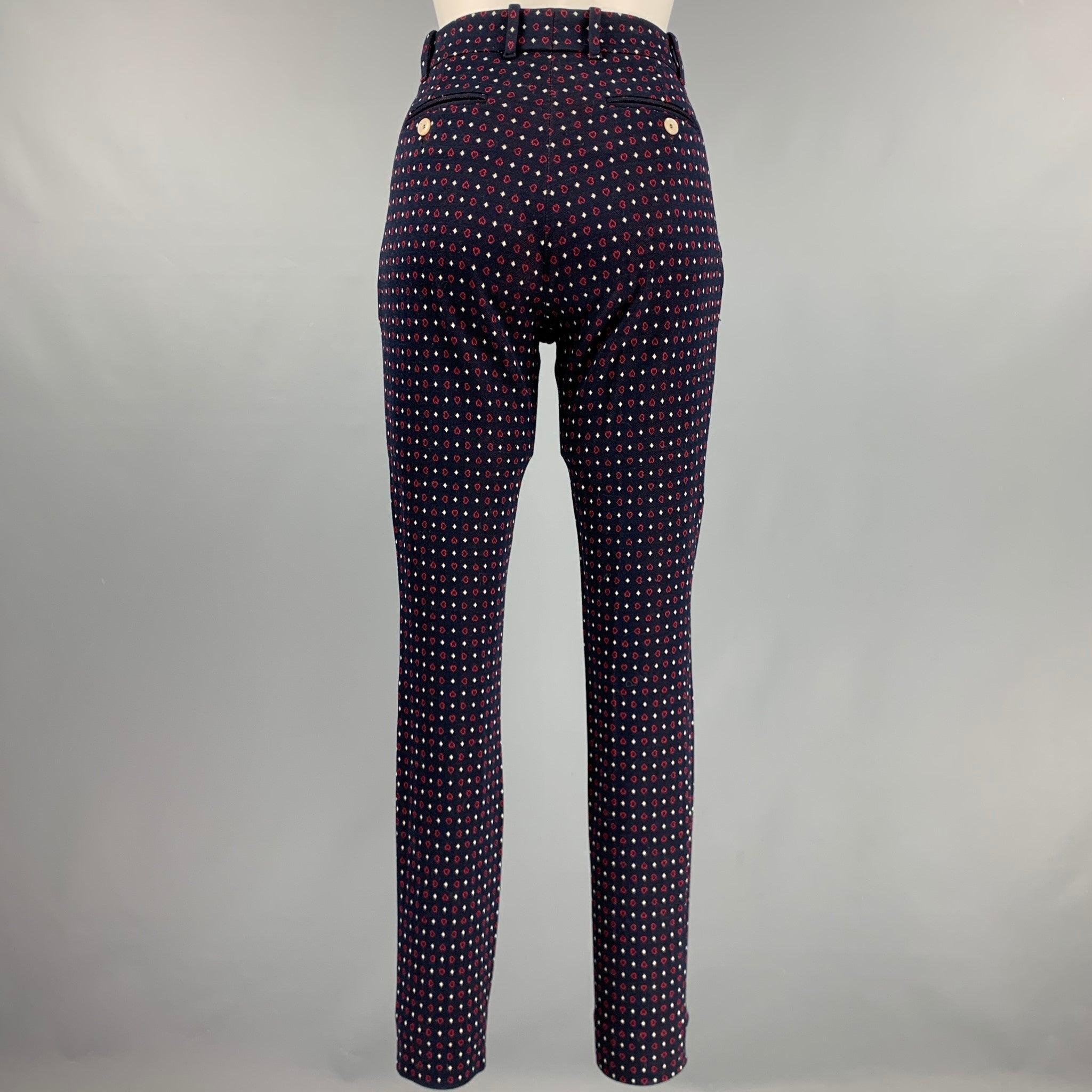 GUCCI casual pants
in a navy cotton fabric featuring red hearts and white diamonds pattern, a narrow leg style, and zip fly closure. Made in Italy.Excellent Pre-Owned Condition. 

Marked:   36 

Measurements: 
  Waist: 27 inches Rise: 8.5 inches