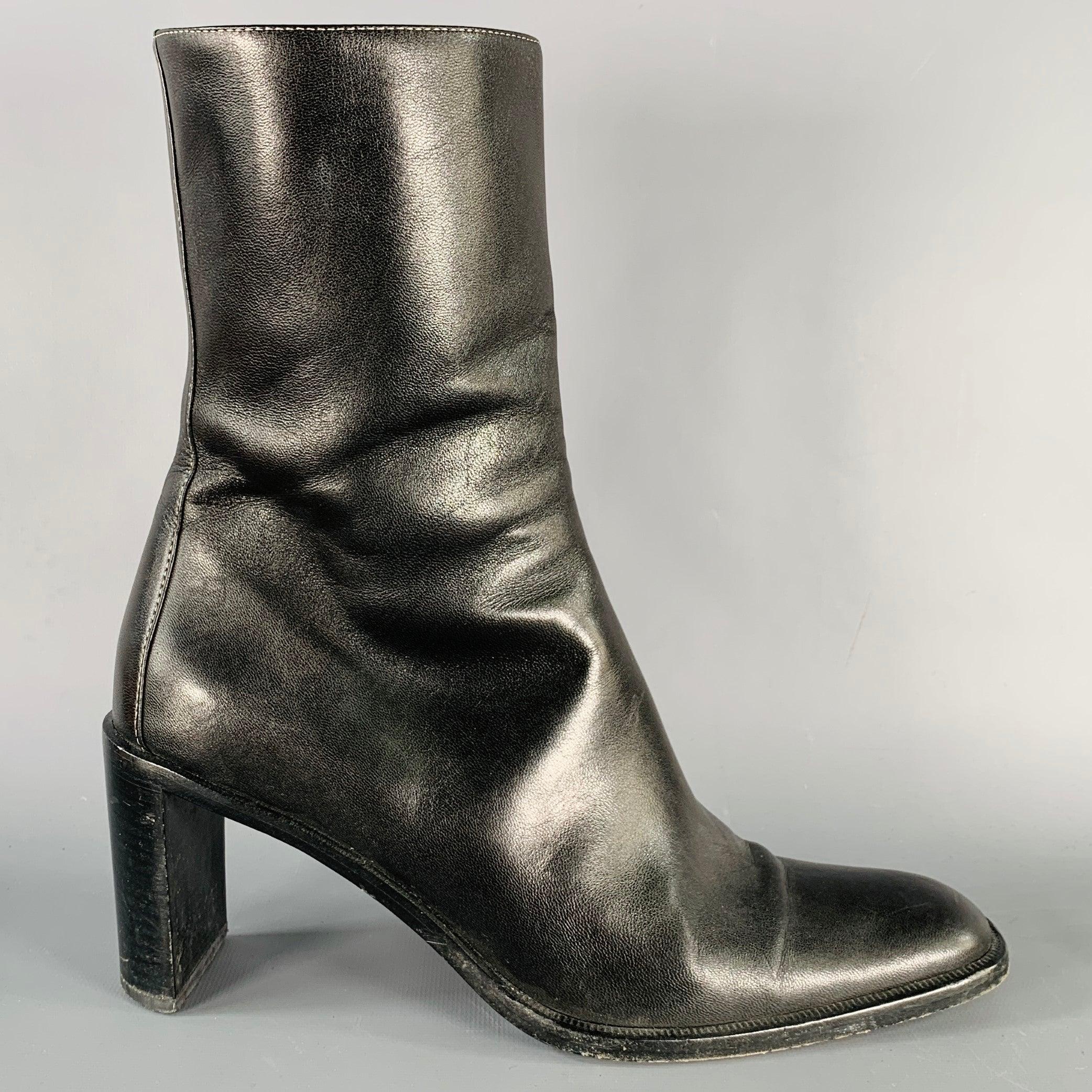 GUCCI boots
in a black leather featuring white contrast stitching, stacked heel, and side zipper closure. Made in Italy.Very Good Pre-Owned Condition. Moderate signs of wear. 

Marked:   104 0342 0 9.5B 

Measurements: 
  Length: 10.5 inches Width: