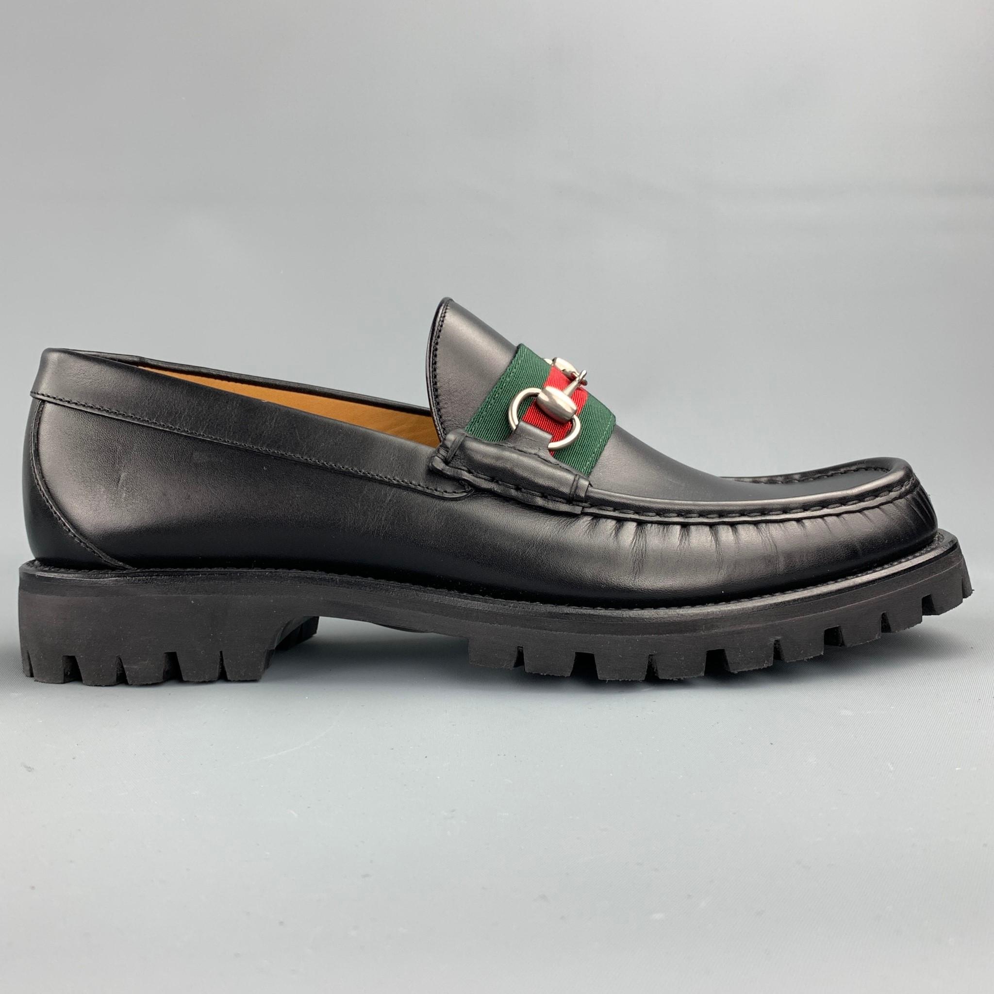 GUCCI loafers comes in a black leather wit a stripe trim featuring a web horsebit design and a lug rubber sole. Minor wear. Made in Italy.

Very Good Pre-Owned Condition.
Marked: 496246 10 14A

Outsole:

12 in. x 4 in. 