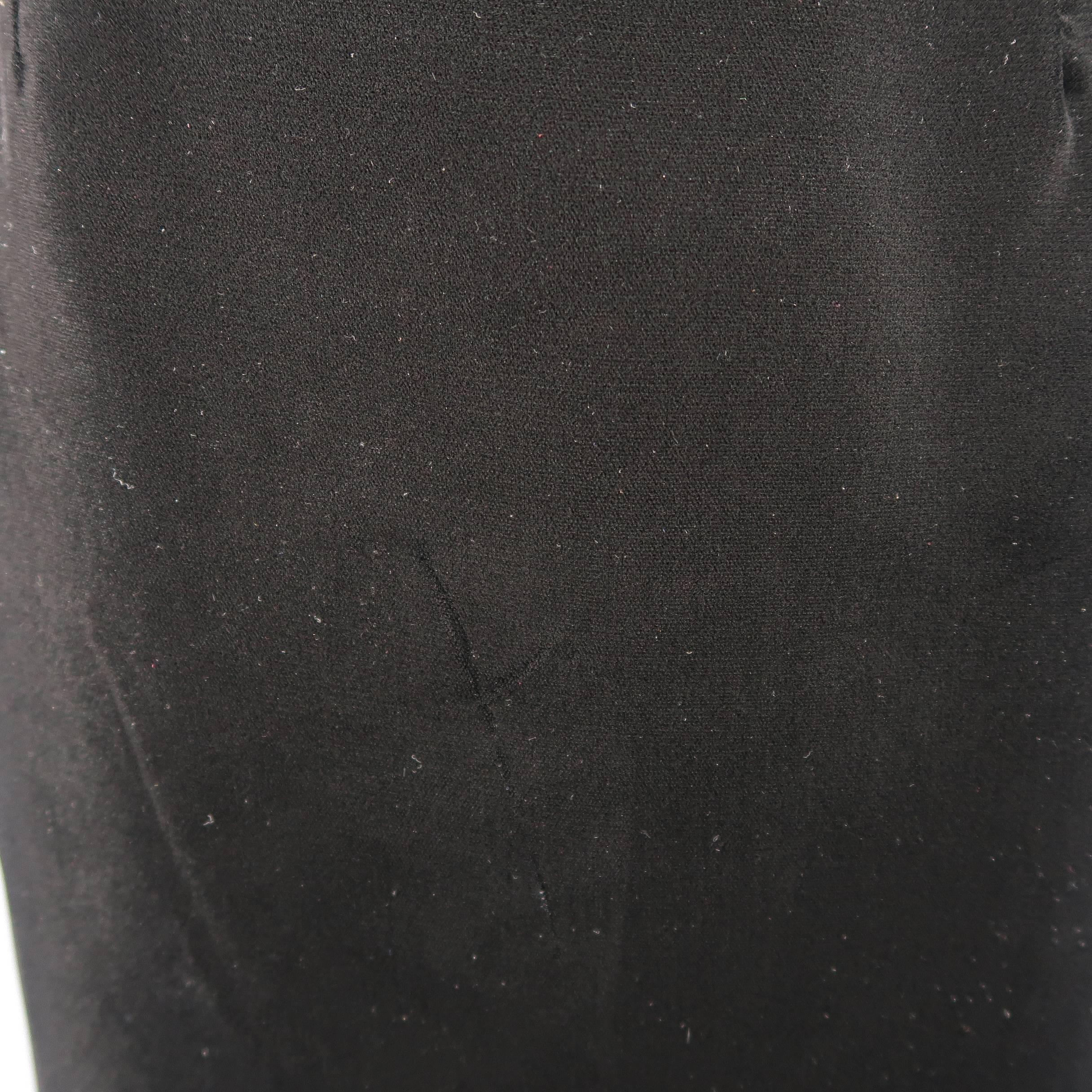 Archive GUCCI skirt comes in black velvet with a classic straight pencil silhouette and buttoned side tabs. Made in Italy.
 
Good Pre-Owned Condition.
Marked: IT 46
 
Measurements:
 
Waist: 29 in.
Hip: 39 in.
Length: 25 in.
