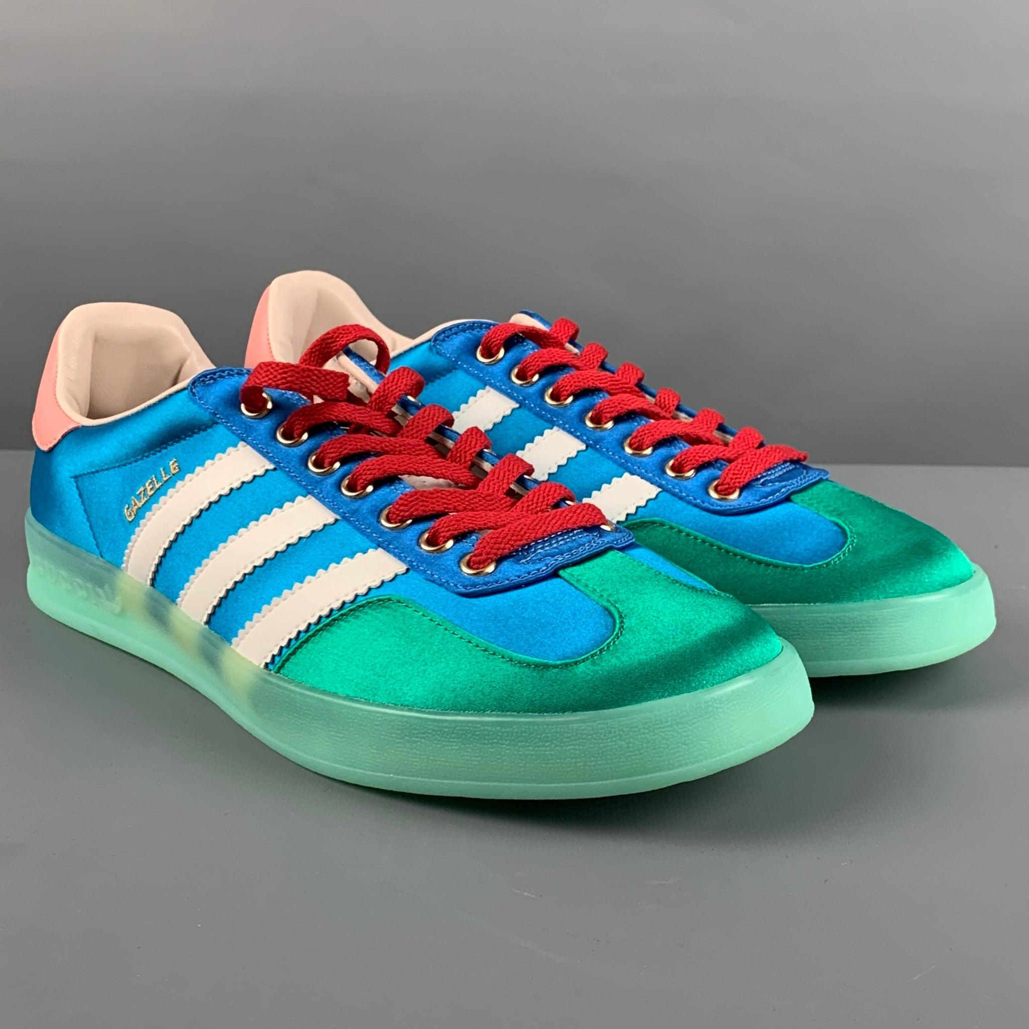 ADIDAS x GUCCI
GAZELLE sneakers comes in blue, green, pink, and white satin woven material featuring the iconic Samba style, color block, leather details, and a red lace up closure. Made in Italy.Excellent Pre-Owned Condition. 

Marked:   43Outsole: